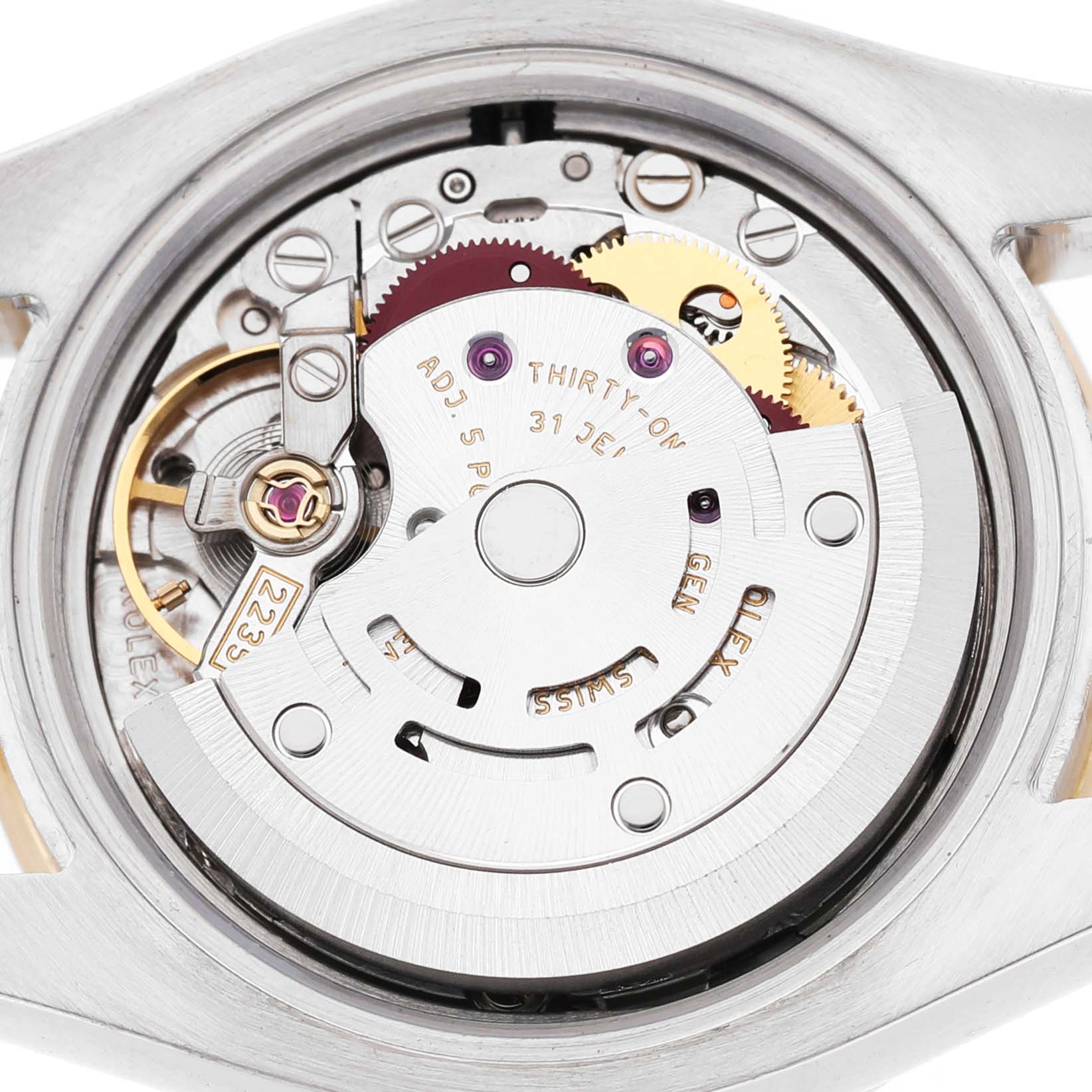 The image shows the movement of a Rolex Datejust 179313 Men's Steel and Gold (two tone) Silver Dial watch from a top-down angle, highlighting gears and interior components.