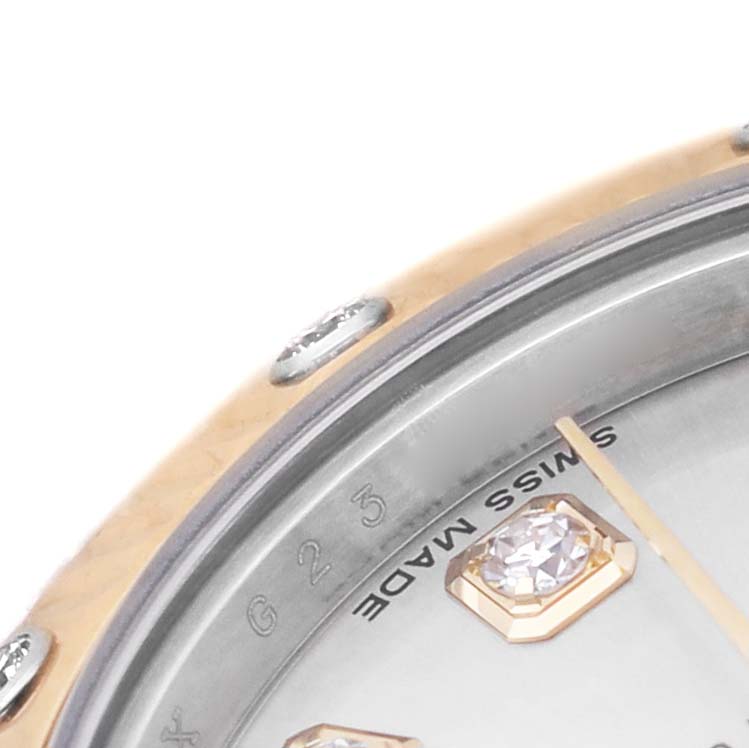 This close-up image shows the bezel and part of the dial of the Rolex Datejust 179313 Men's Steel and Gold (two tone) Silver Dial, featuring diamond markers.