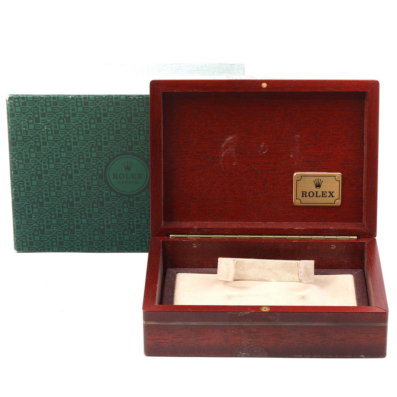 The image shows an open Rolex watch box for the Daytona model, with the outer packaging visible in the background.