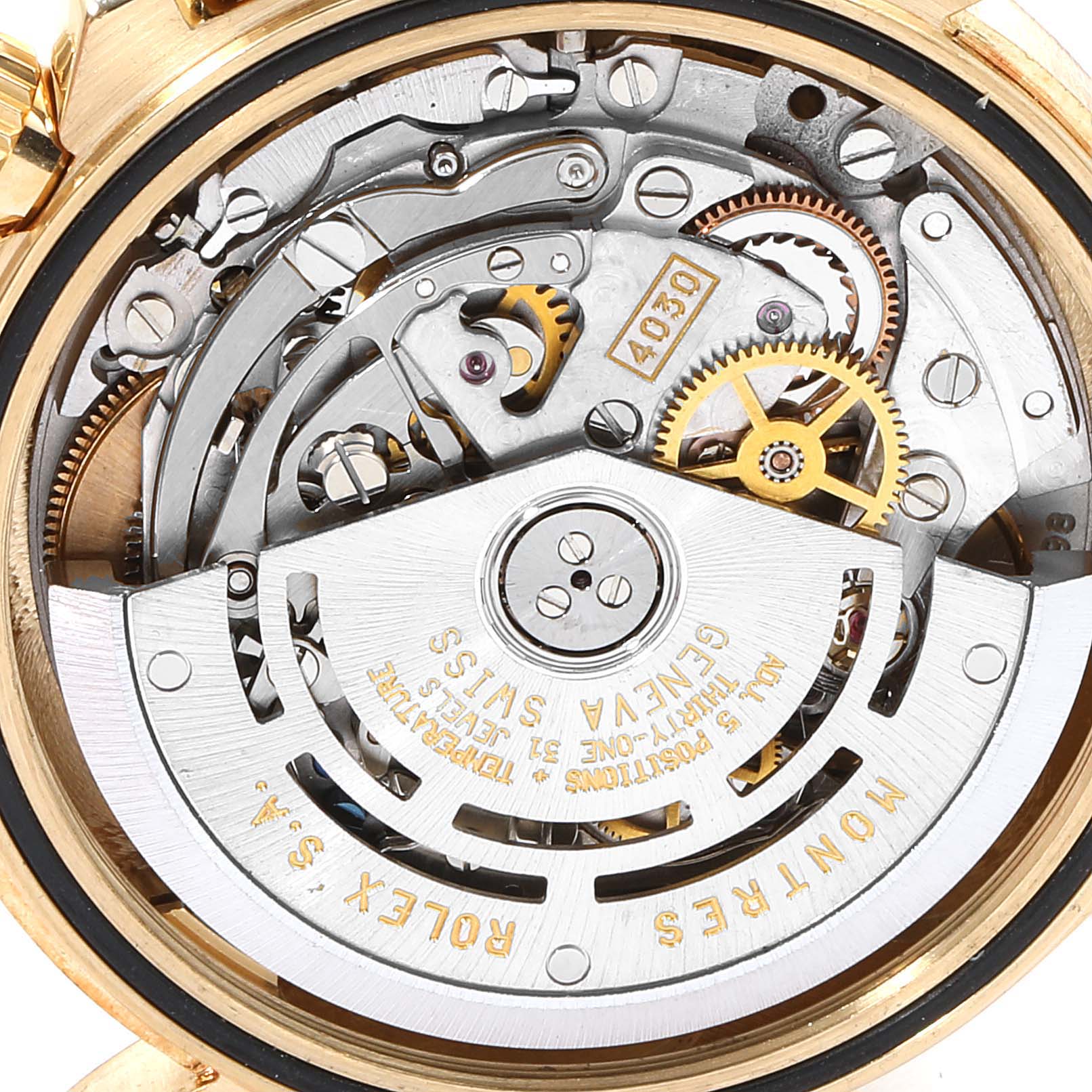 The image shows the exposed movement and internal components of a Rolex Daytona 16528 Men's Yellow Gold Black Dial 16528 Men's Yellow Gold Black Dial watch from a close-up, back angle.