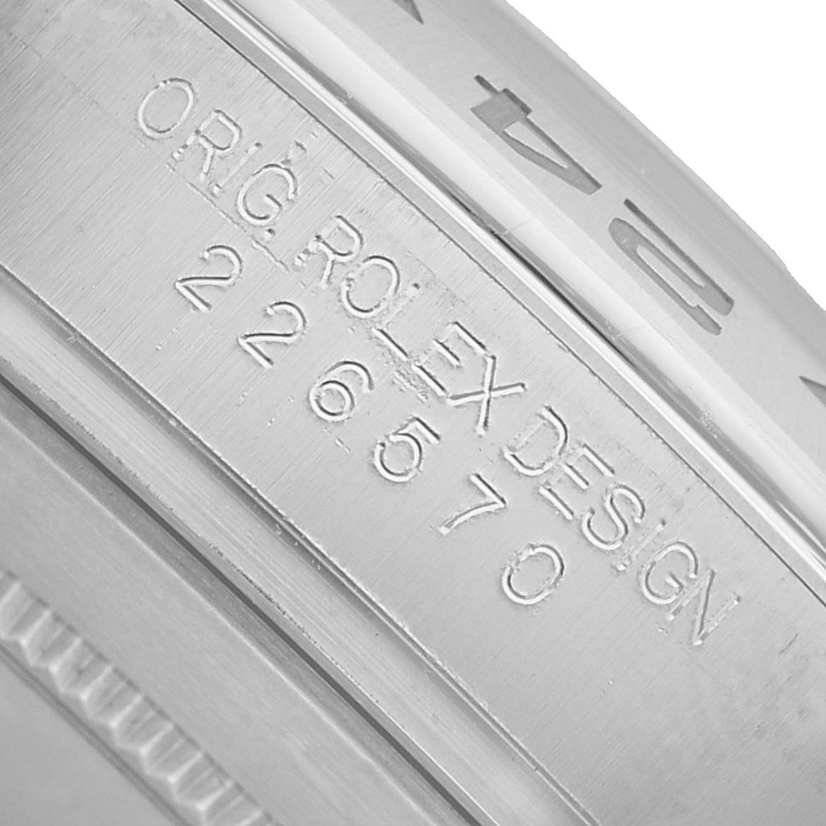 The image shows a close-up of the engraved inner bezel, or rehaut, of a Rolex Explorer 226570 Men's Stainless Steel Black Dial watch.
