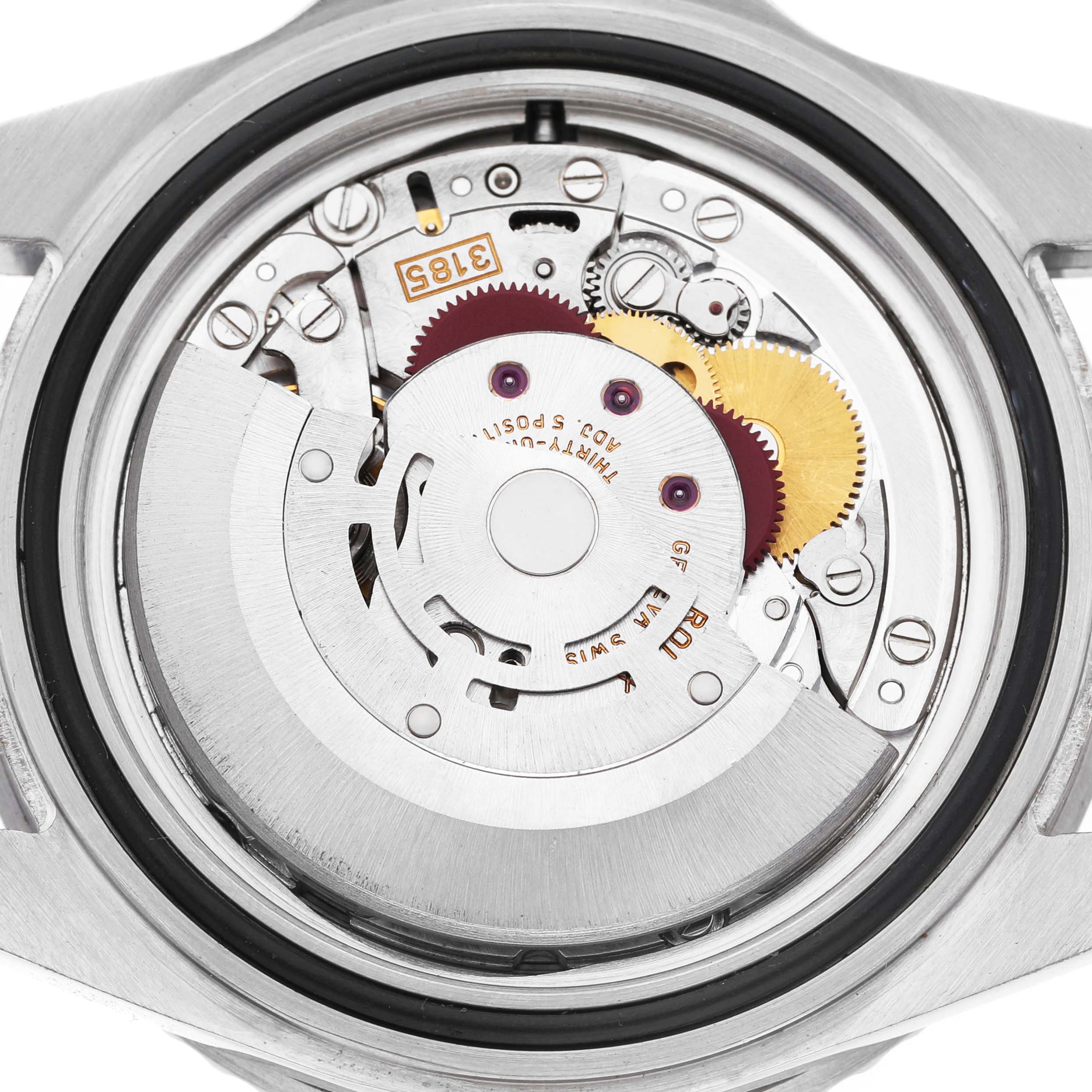 The image shows the movement of a Rolex GMT-Master 16710 Men's Stainless Steel Black Dial watch viewed from the back, displaying gears and components.