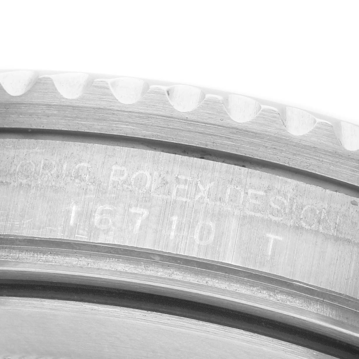 The image shows a close-up of the side of a Rolex GMT-Master 16710 Men's Stainless Steel Black Dial, highlighting the model number "16710 T" engraved on the case.
