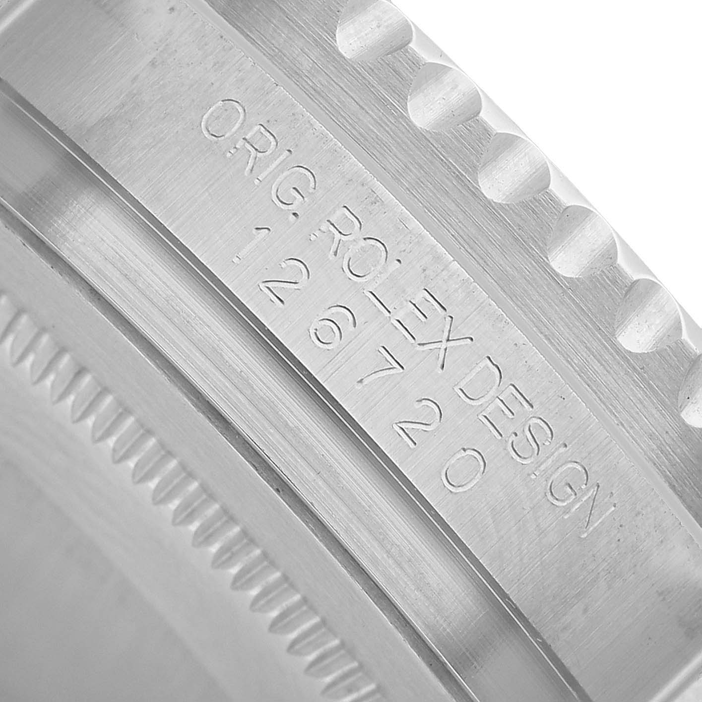 The image shows a close-up of the side of a Rolex GMT-Master 126720VTNR Men's Stainless Steel Black Dial watch, focusing on the engravings and bezel teeth.