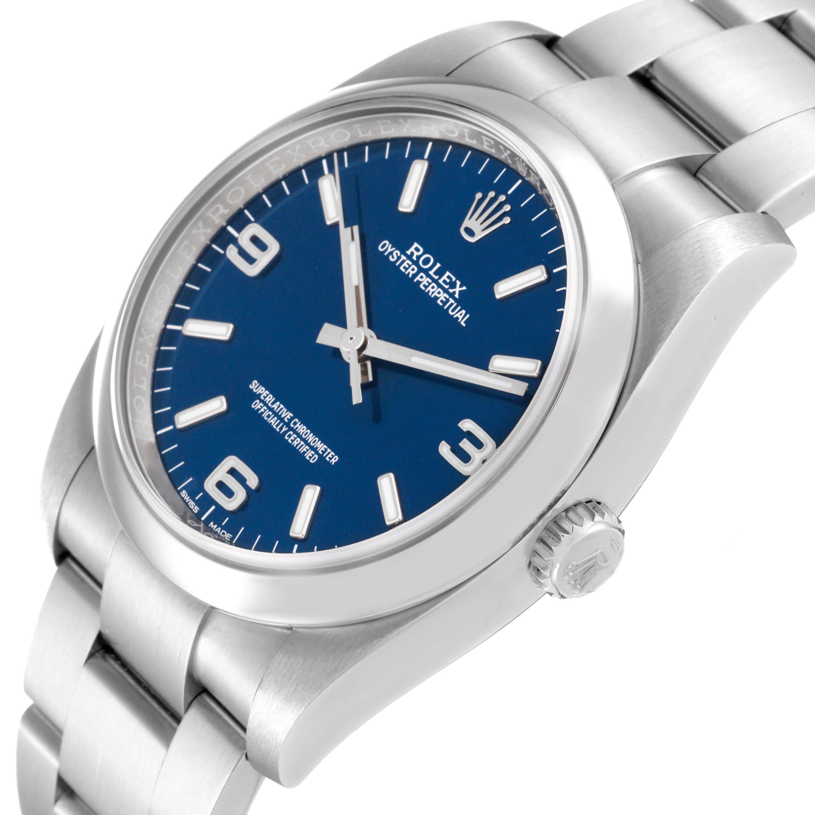 The Rolex Oyster Perpetual 116000 Men
s Stainless Steel Blue Dial 116000 Men
s Stainless Steel Blue Dial watch is shown at an angled side view, highlighting the blue dial, bezel, case, bracelet, and crown.