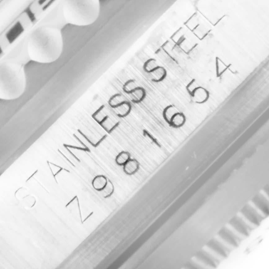 The image shows a close-up of the serial number and part of the bezel of a Rolex Sea-Dweller 16600 Men
s Stainless Steel Black Dial 16600 Men
s Stainless Steel Black Dial watch.