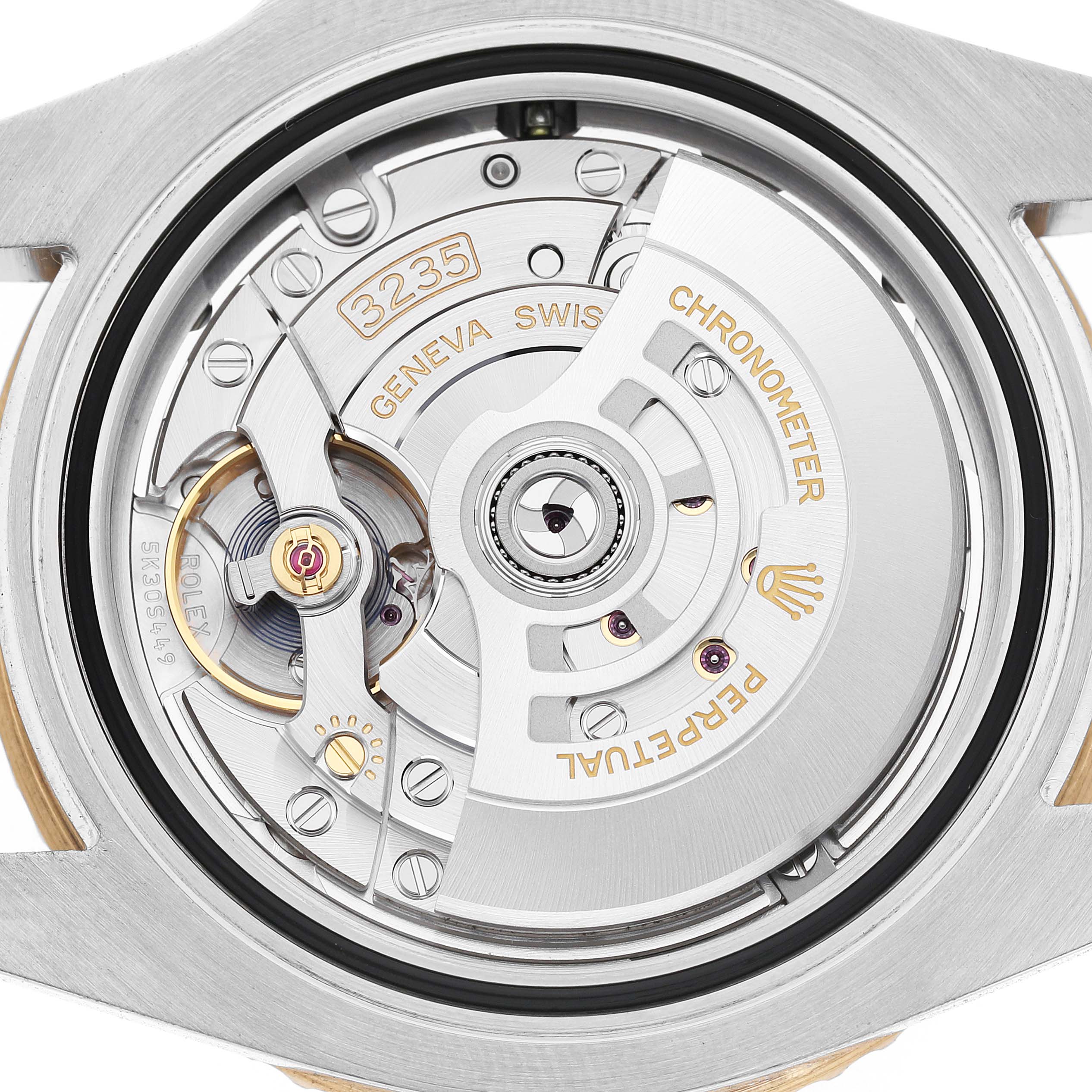 This image shows the movement mechanism of a Rolex Submariner 126613 Men's Steel and Gold (two tone) Blue Dial, highlighting the rotor and intricate components.