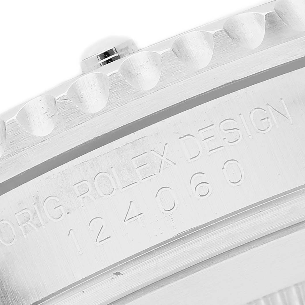 The image shows a side view of the Rolex Submariner 124060 Men's Stainless Steel Black Dial's bezel and part of the case, highlighting engraved model details.