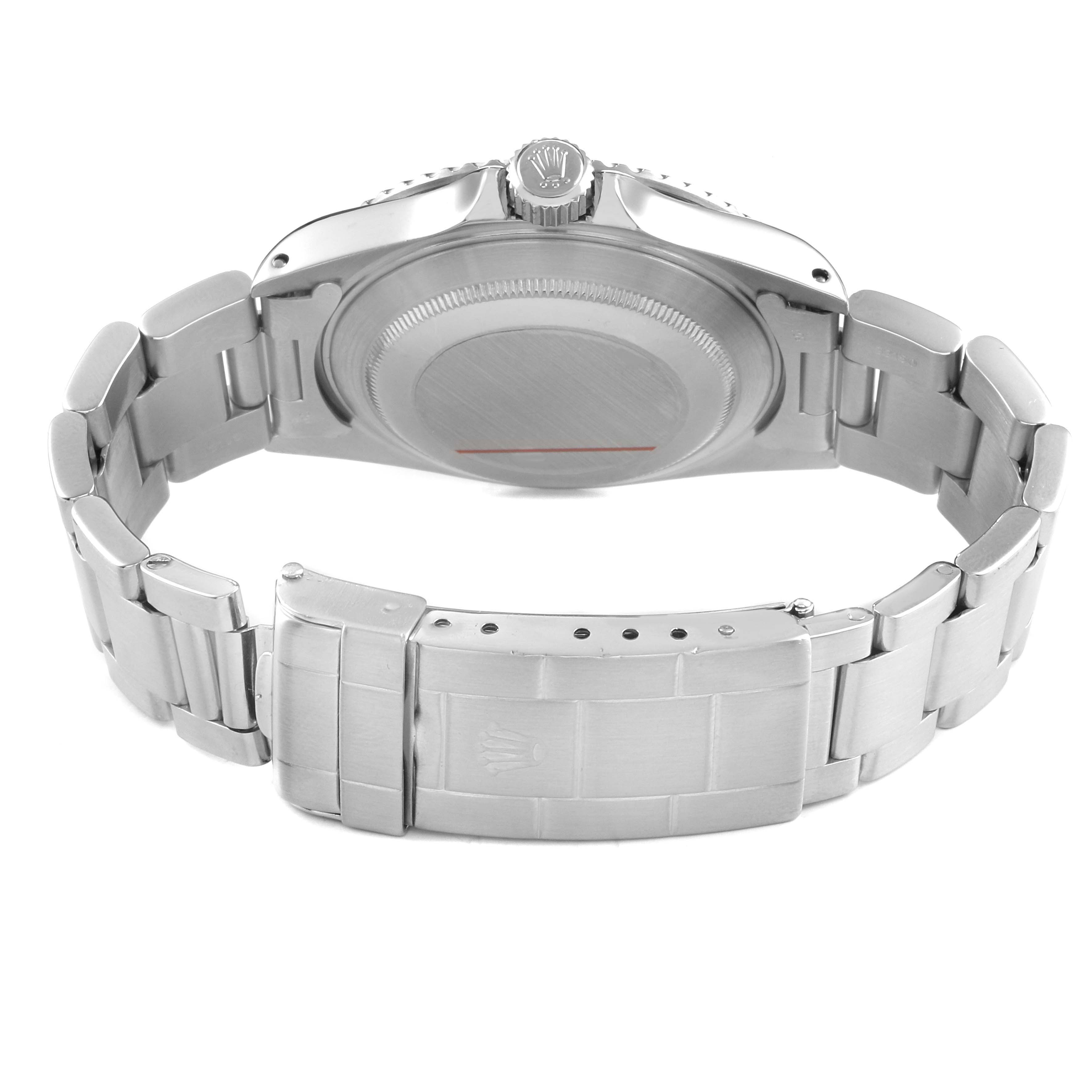 The image shows the back view of a Rolex Submariner 14060 Men's Stainless Steel Black Dial, highlighting its case back, crown, and bracelet clasp.