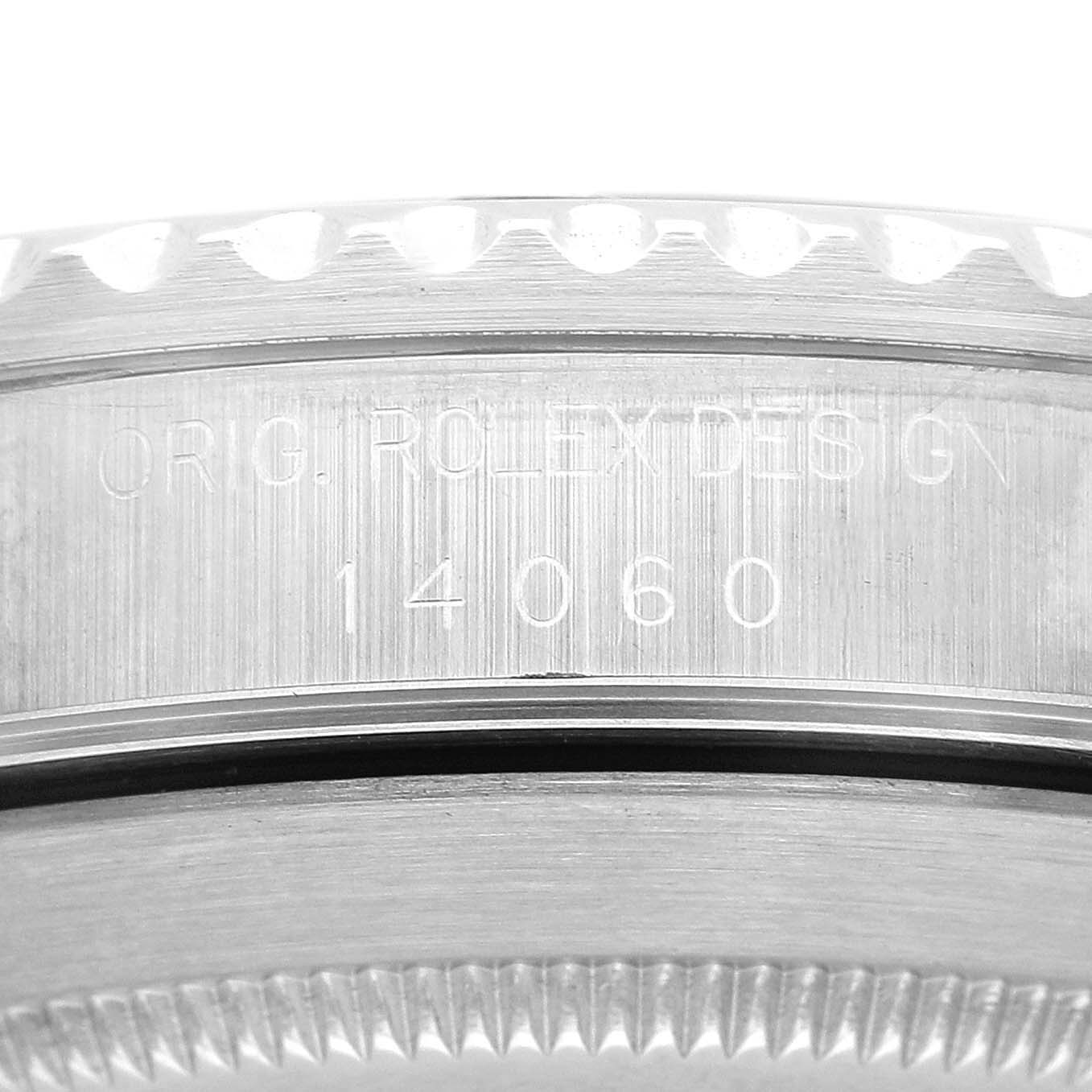The image shows the side engraving on the case of a Rolex Submariner 14060 Men's Stainless Steel Black Dial, highlighting the model number.
