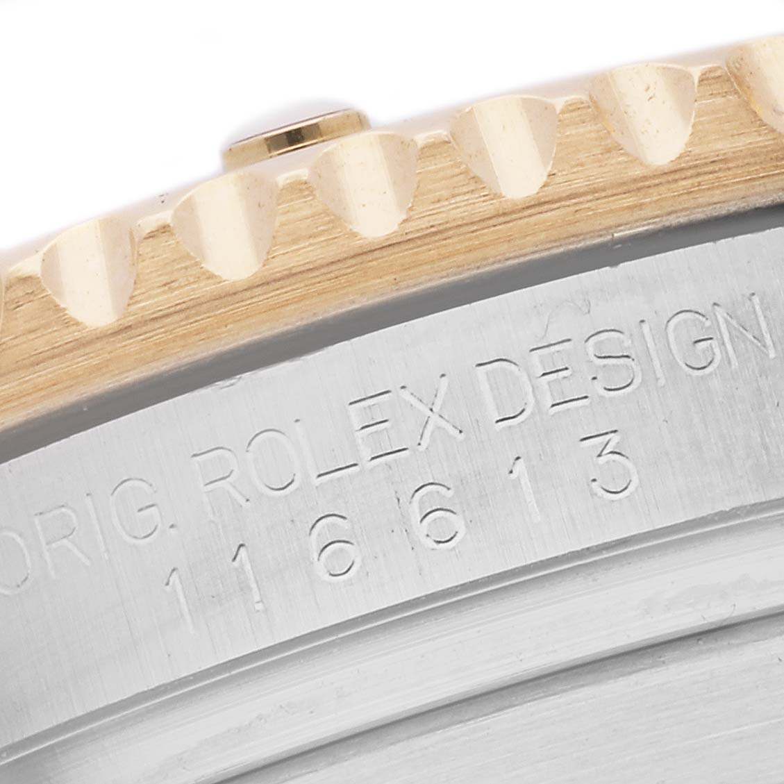 The image shows a close-up of the bezel and engraved case side of a Rolex Submariner 116613LN Men's Steel and Gold (two tone) Black Dial 116613LN Men's Steel and Gold (two tone) Black Dial watch.