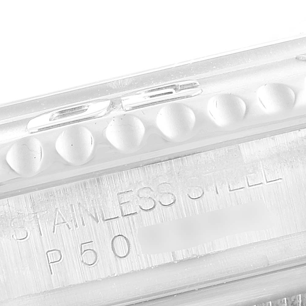 This image shows a close-up of the side of a Yacht-Master watch by Rolex, highlighting the stainless steel engraving.