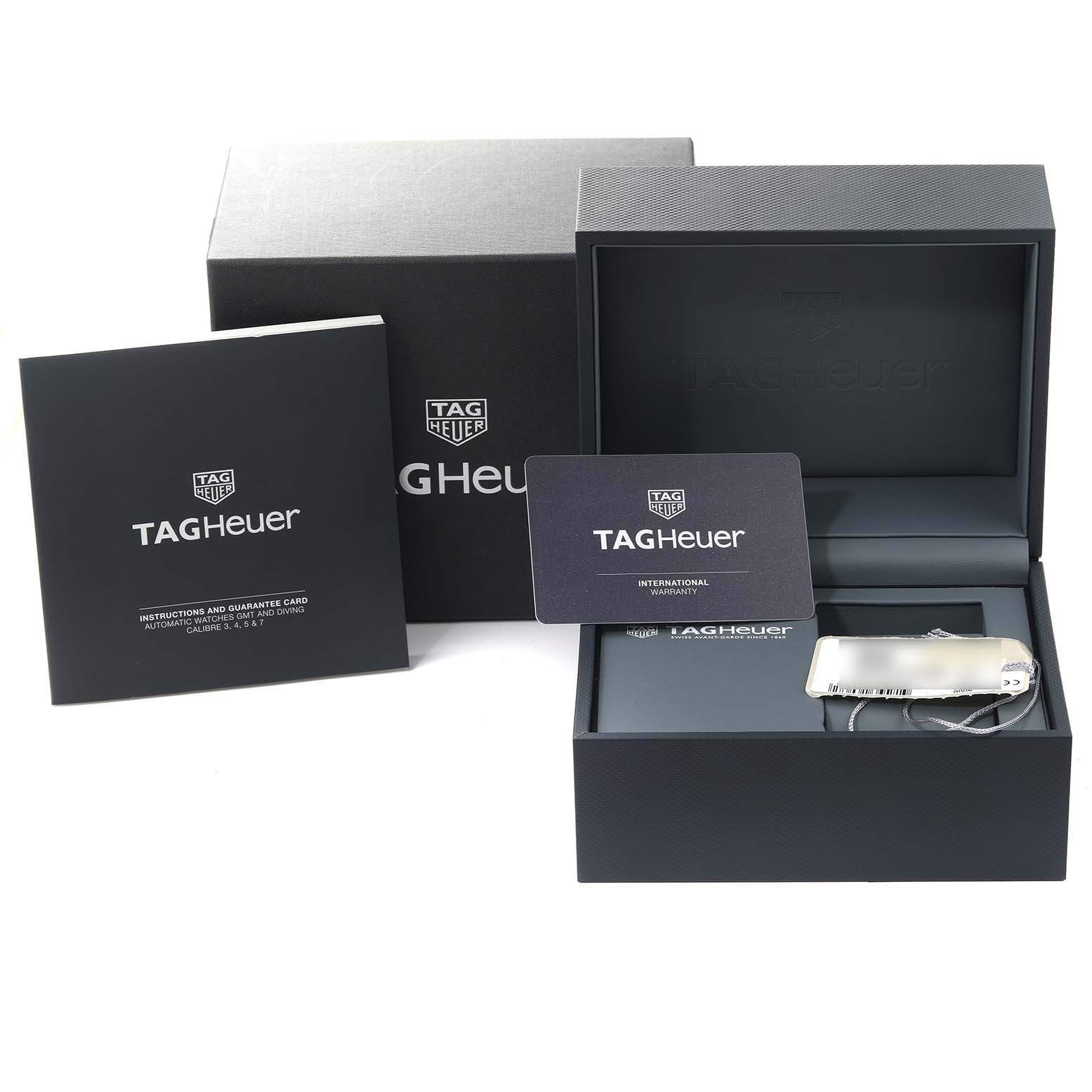 The image shows the packaging, warranty card, and instruction manual for a Tag Heuer Aquaracer WBP201B.BA0632 Men's Stainless Steel Blue Dial WBP201B.BA0632 Men's Stainless Steel Blue Dial watch.