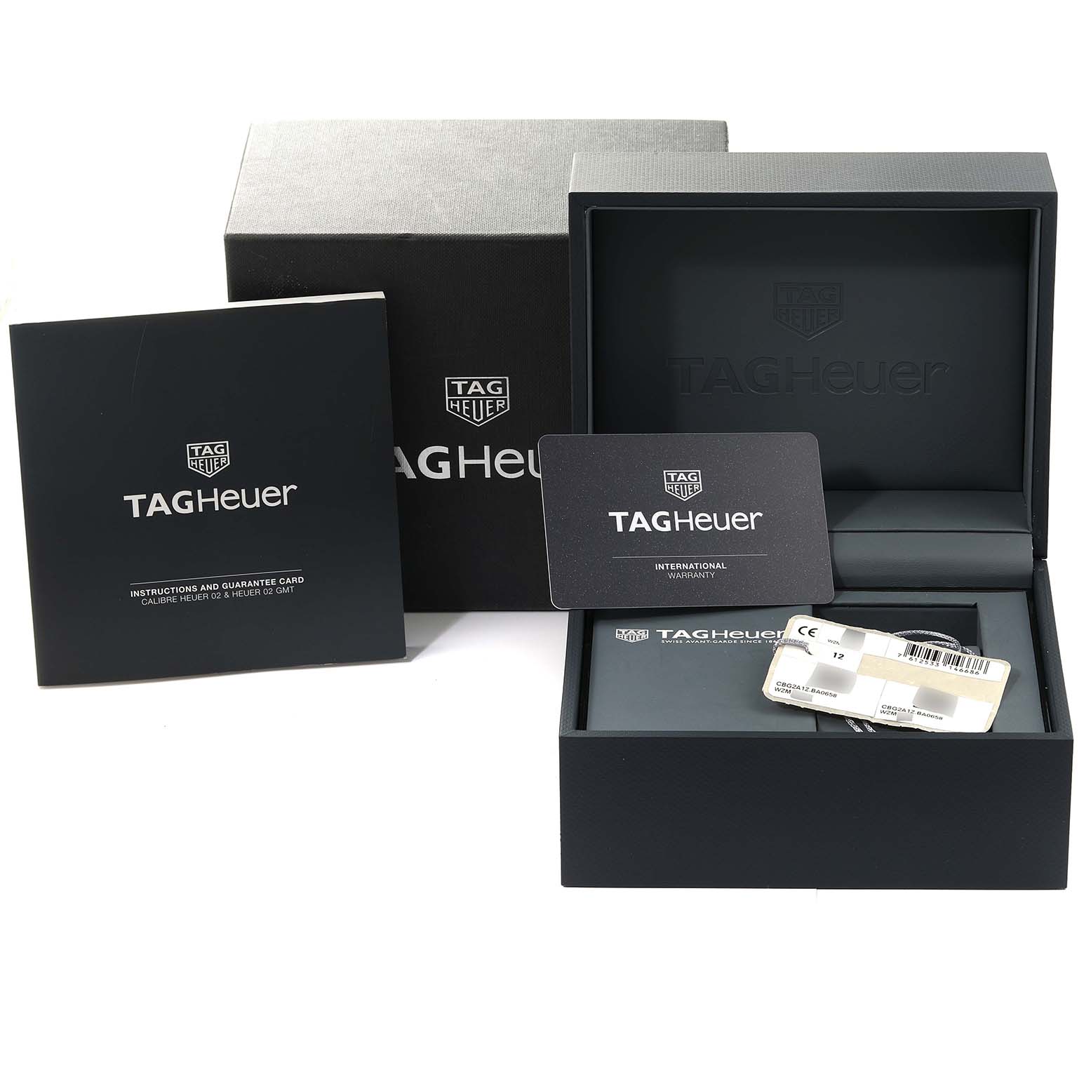 The image shows the packaging, instruction booklet, and warranty card for the Tag Heuer Carrera CBG2A1Z.BA0658 Men's Stainless Steel Black Dial CBG2A1Z.BA0658 Men's Stainless Steel Black Dial model.