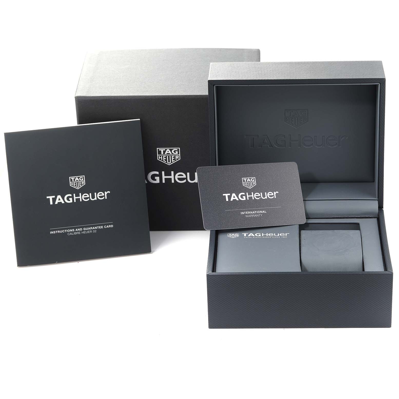 This image shows the box, warranty card, and instruction manual for a Tag Heuer Limited Edition CBG2019.BA0662 Men's Stainless Steel Blue Dial CBG2019.BA0662 Men's Stainless Steel Blue Dial model watch.