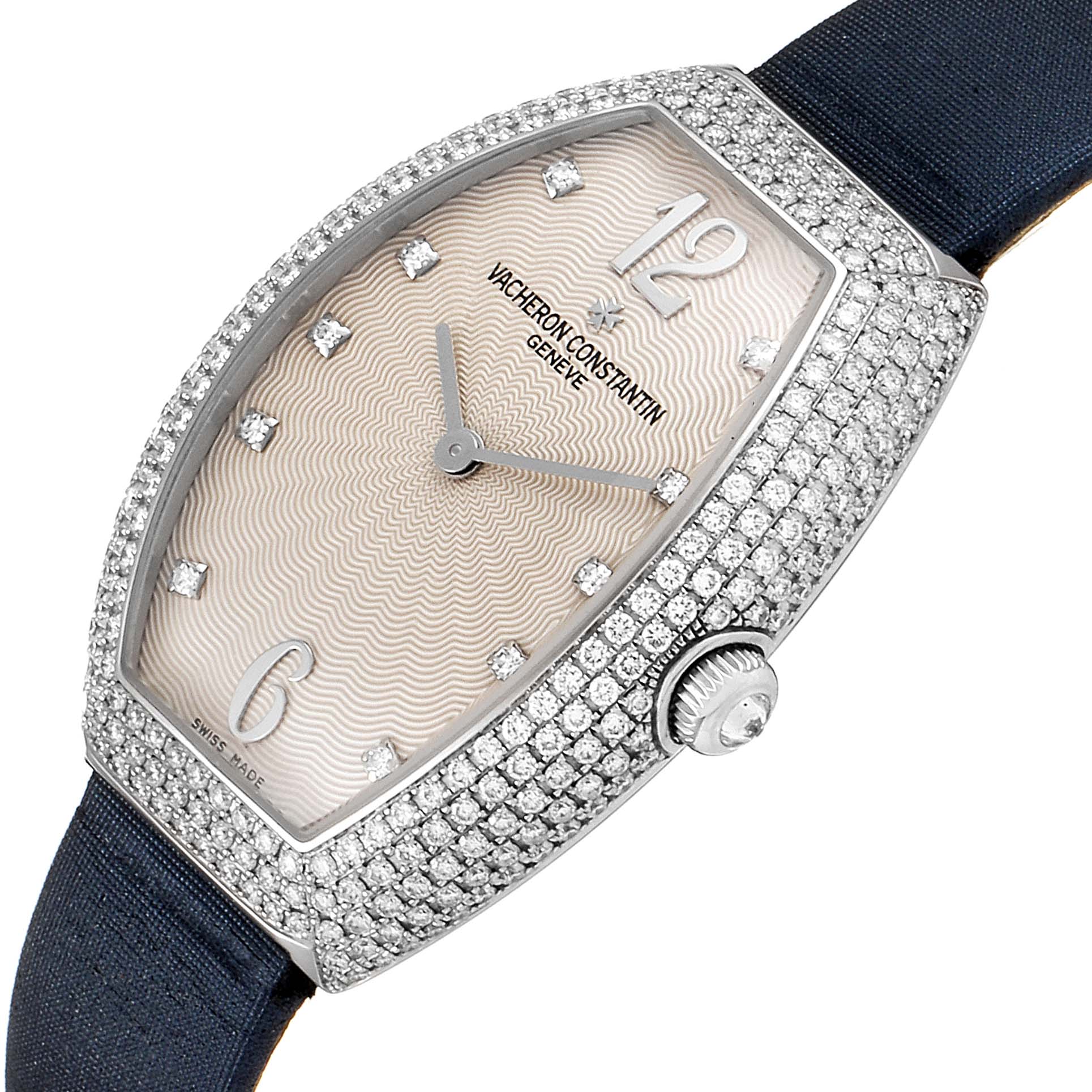 This Vacheron Constantin Egerie 25541 Women's White Gold Silver Dial 25541 Women's White Gold Silver Dial watch is shown at an angled view, highlighting the diamond-studded case, face, and strap.