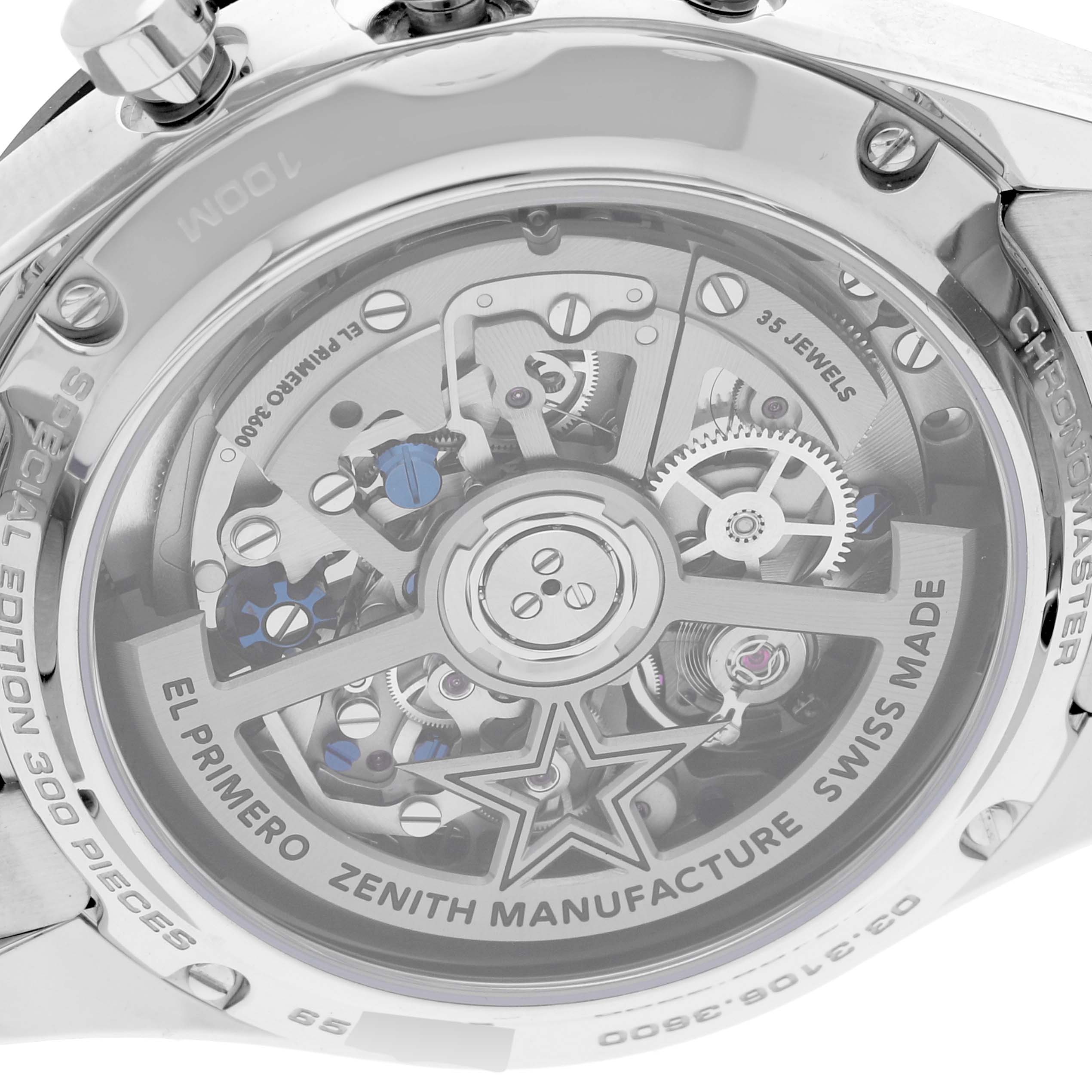 The image shows the back view of the Zenith El Primero watch, highlighting its intricate movement and components within the case.