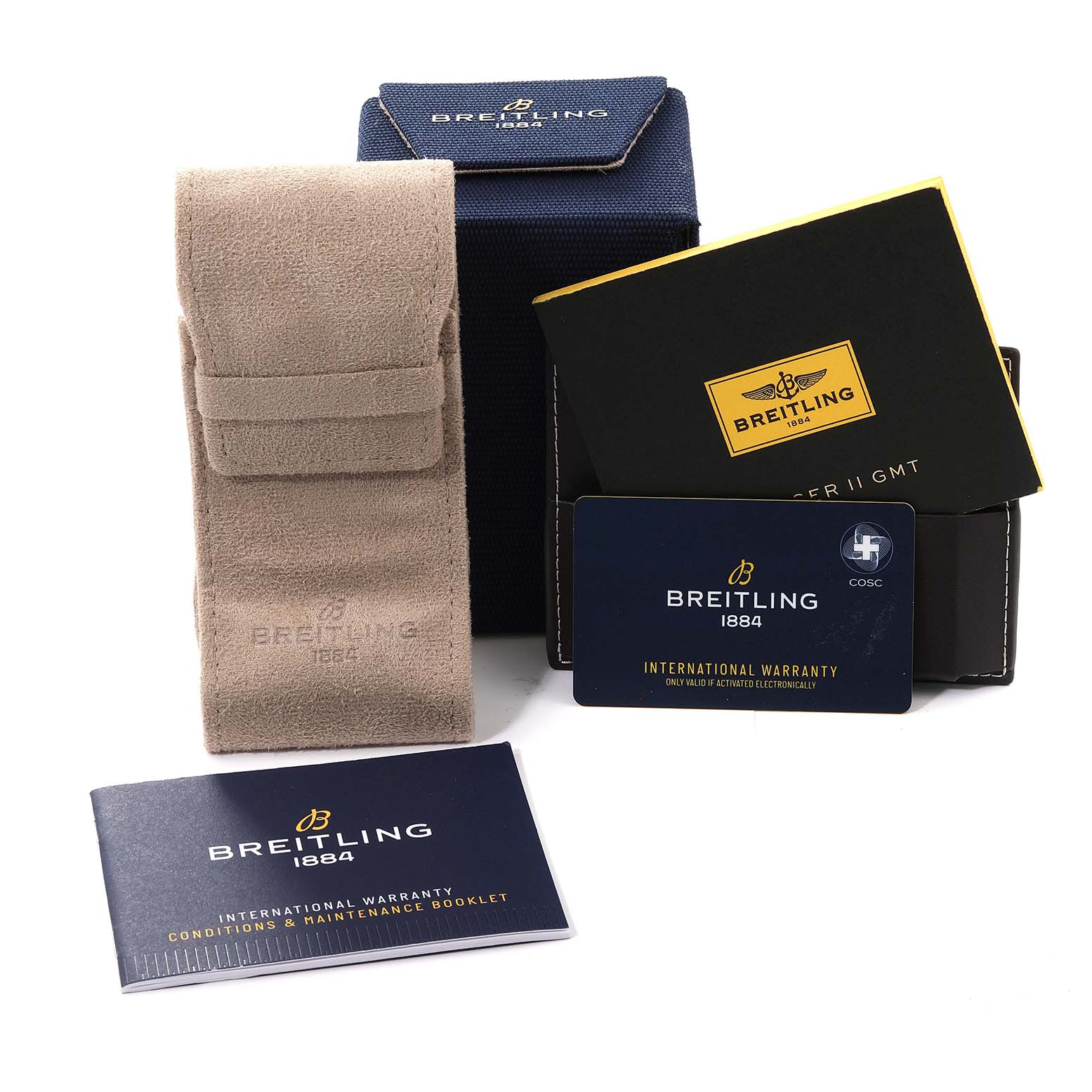 The image shows various accessories for the Breitling Avenger A32390 Men's Stainless Steel Mother of Pearl Dial A32390 Men's Stainless Steel Mother of Pearl Dial watch, including a box, pouch, warranty card, and booklet.