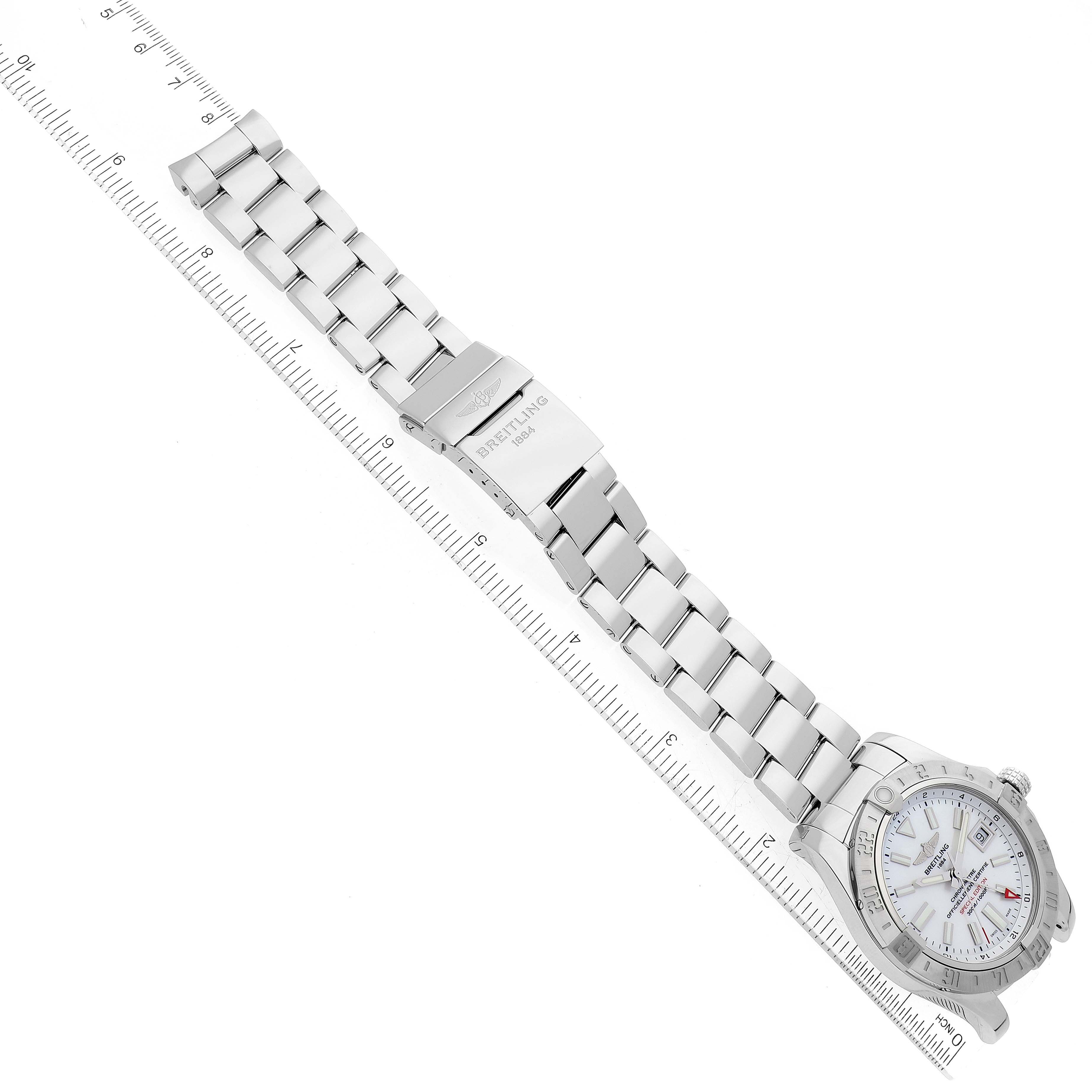 The image shows a top view of a Breitling Avenger A32390 Men's Stainless Steel Mother of Pearl Dial A32390 Men's Stainless Steel Mother of Pearl Dial watch, displaying the watch face, bracelet, and clasp with a ruler for scale.