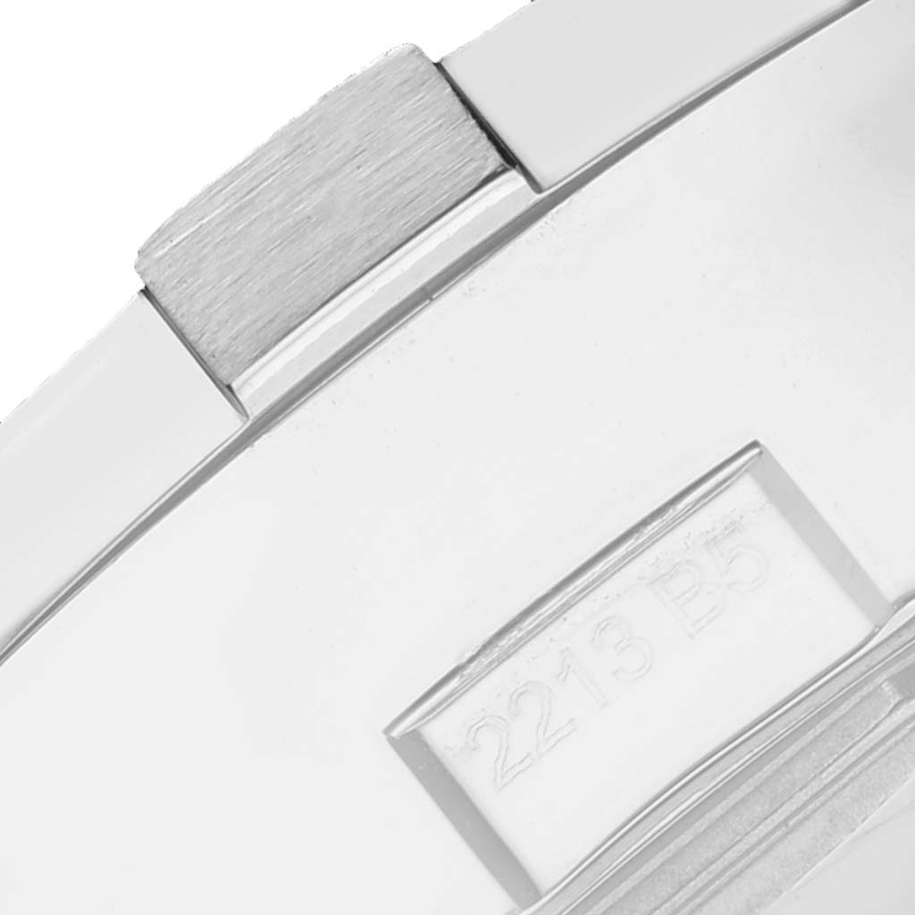 This image shows a close-up of the clasp or buckle of a Breitling Avenger A13381 Men's Stainless Steel Black Dial A13381 Men's Stainless Steel Black Dial watch, highlighting part of its polished metal surface and engraved code.