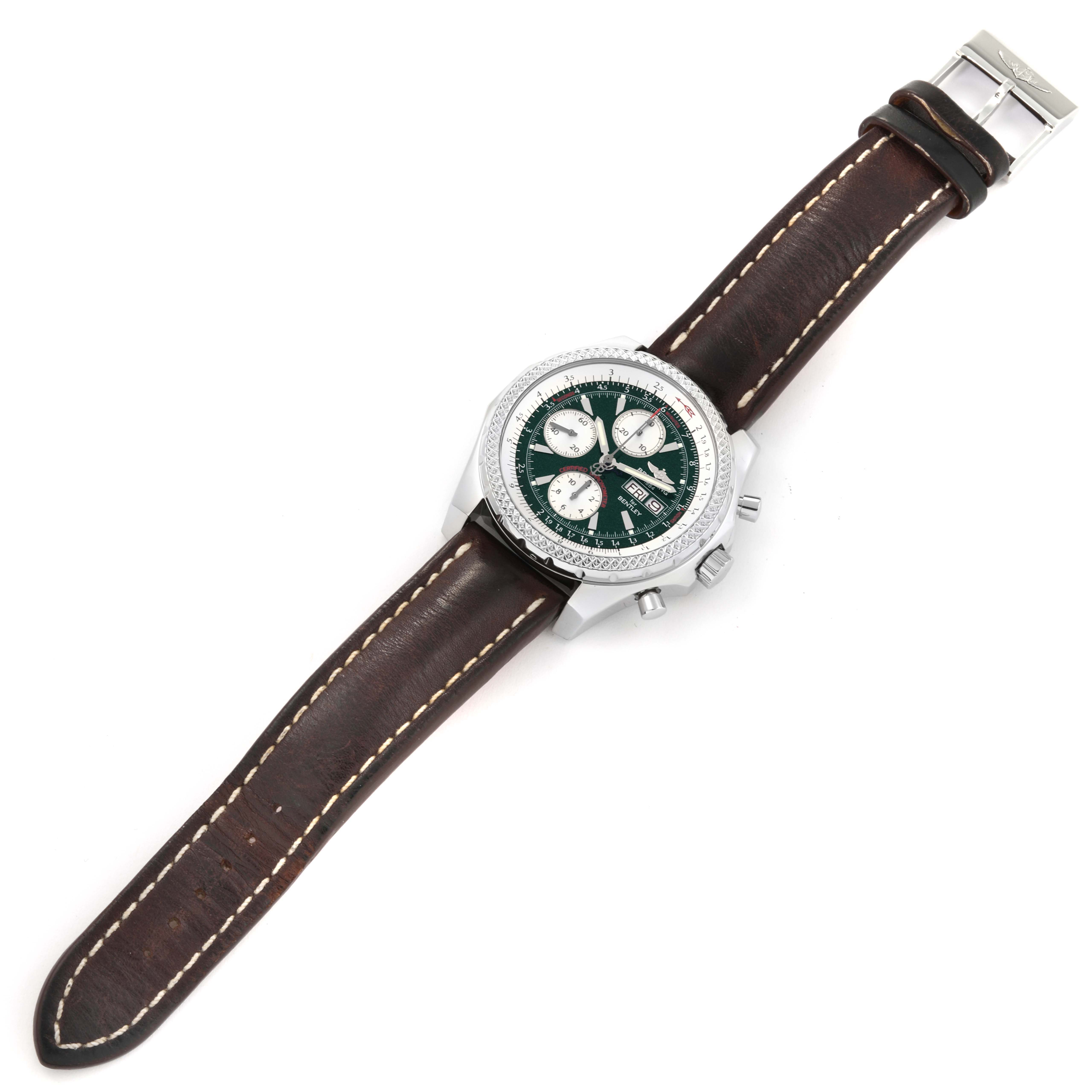 The image shows a top view of the Bentley model by Breitling, featuring its green dial, chronograph sub-dials, and brown leather strap.