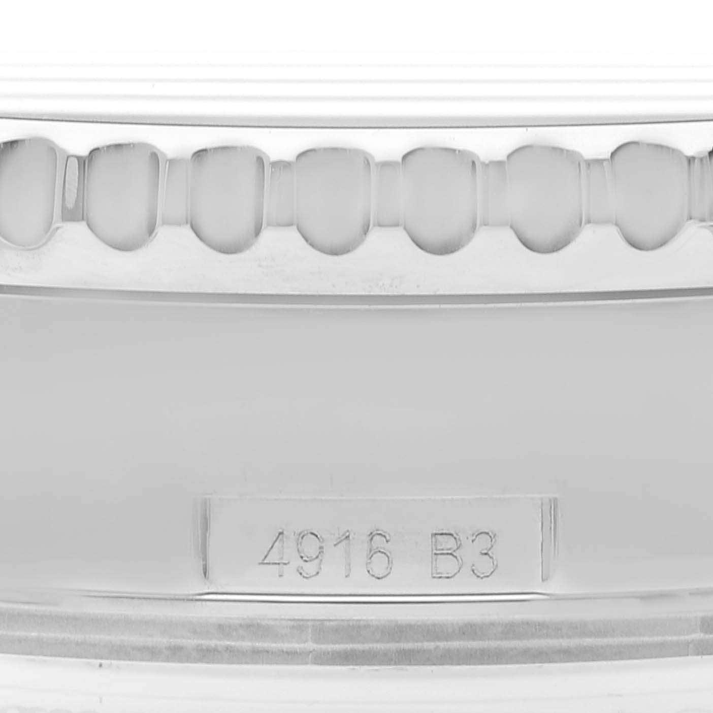 This image shows a close-up of the bezel and serial number of a Breitling Navitimer AB0127 Men
s Stainless Steel Black Dial AB0127 Men
s Stainless Steel Black Dial watch.