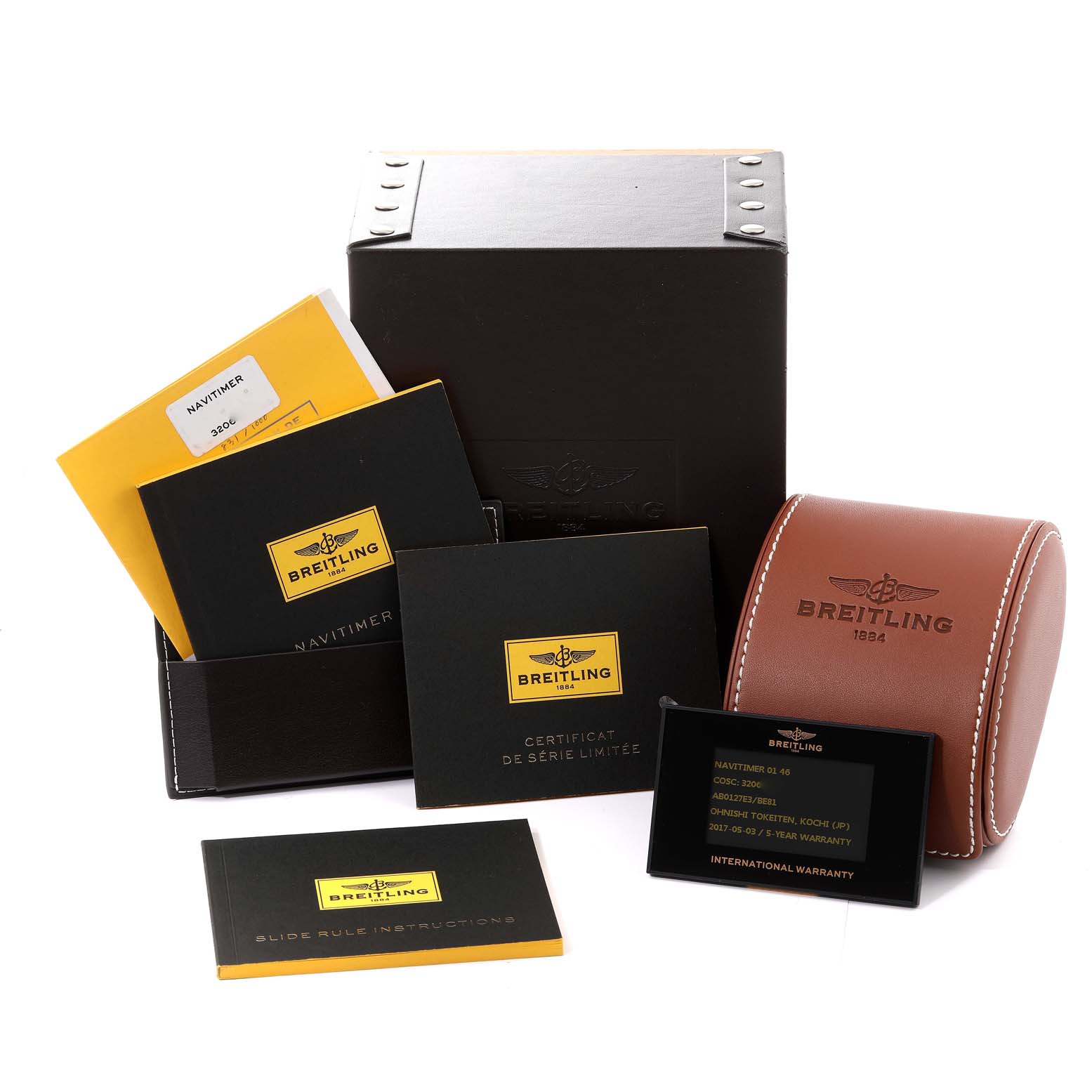 The image shows a Breitling Navitimer AB0127 Men
s Stainless Steel Black Dial AB0127 Men
s Stainless Steel Black Dial watch box, instruction manuals, warranty cards, and a leather pouch from a slightly high front angle.