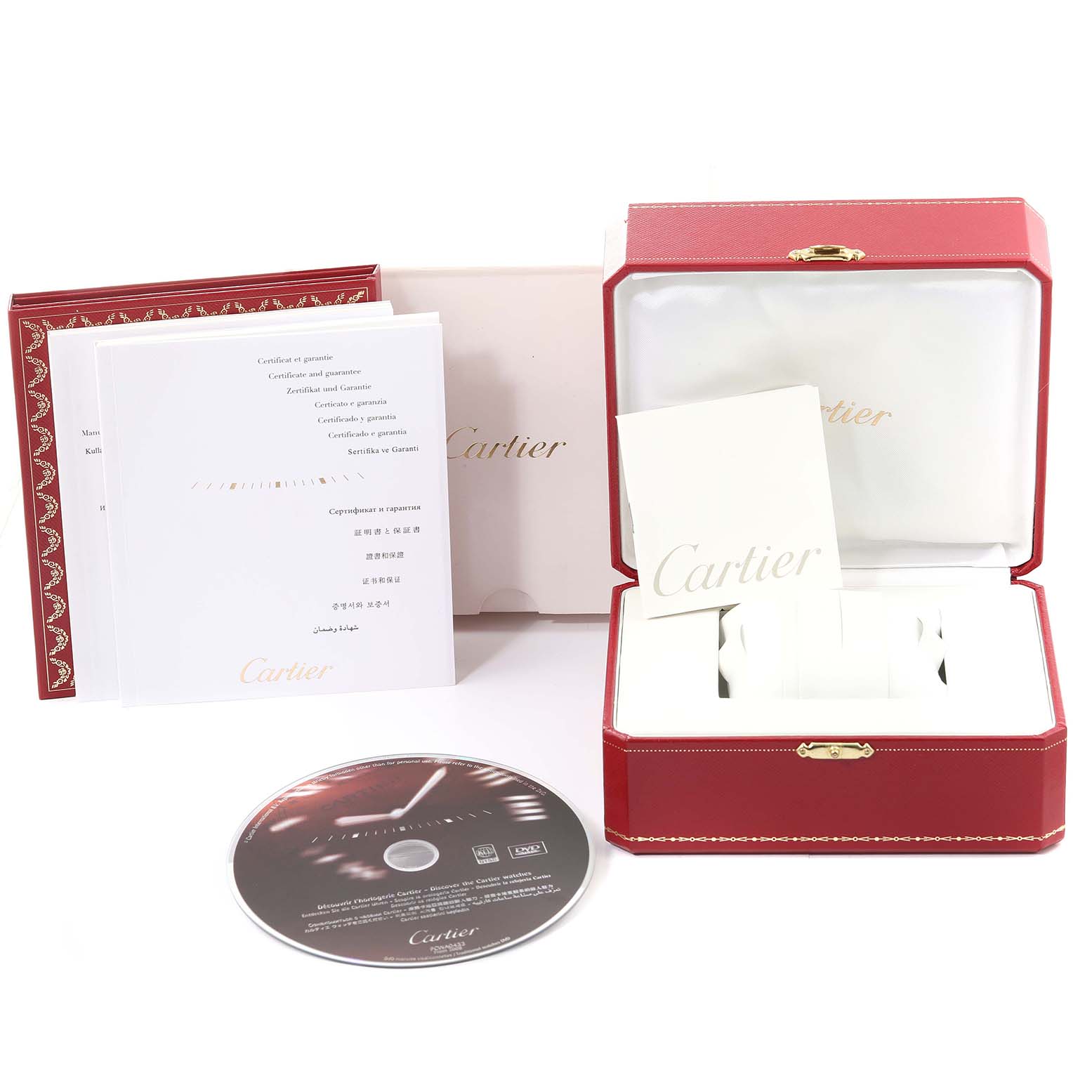 The image shows the Cartier Pasha W31077M7 Men
s Stainless Steel Black Dial W31077M7 Men
s Stainless Steel Black Dial watch
s packaging, including a red box, documents, and a CD, all laid out neatly.