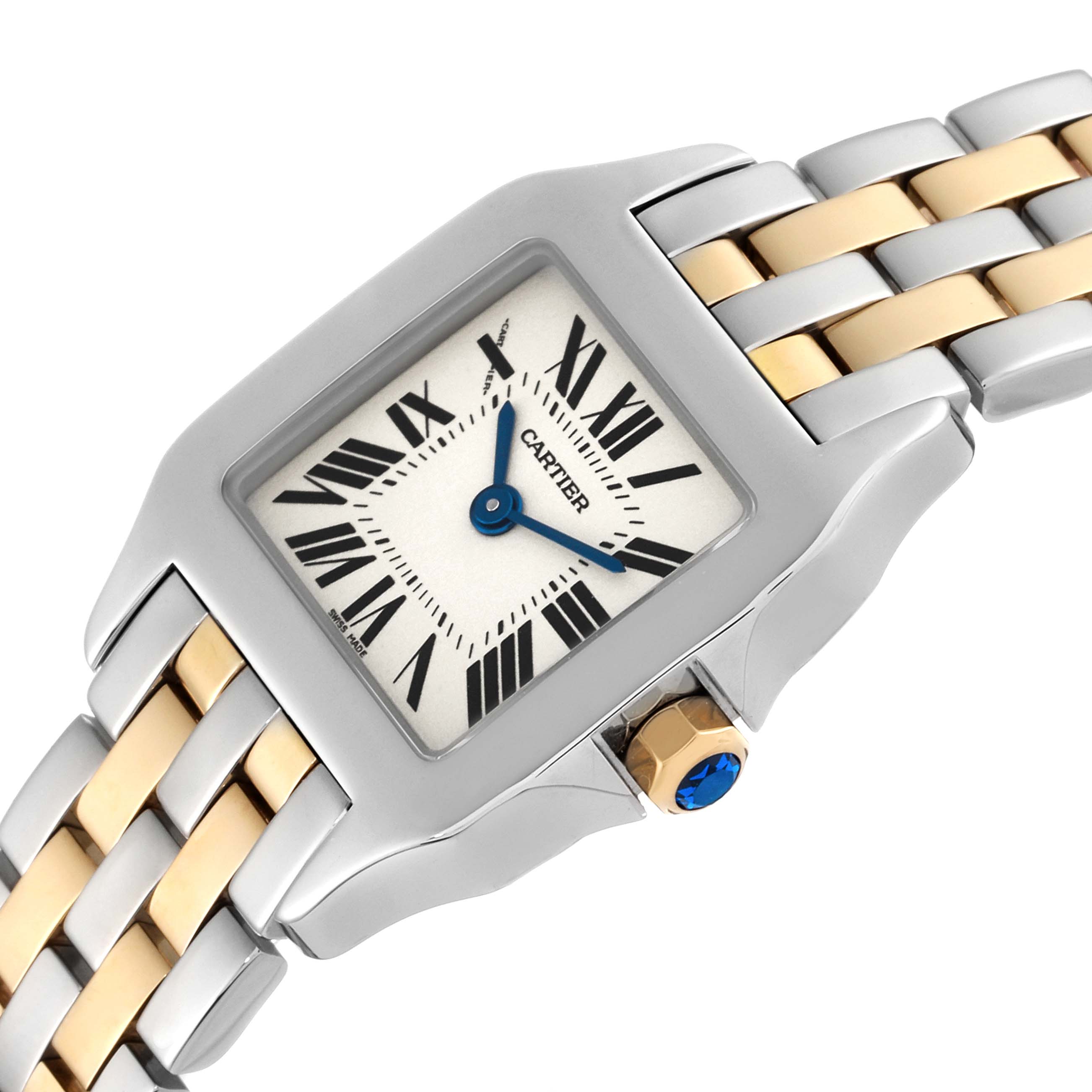 The image shows a close-up angled view of the Cartier Santos Demoiselle W25066Z6 Women
s Steel and Gold (two tone) Silver Dial W25066Z6 Women
s Steel and Gold (two tone) Silver Dial watch, highlighting the dial and part of the bracelet.