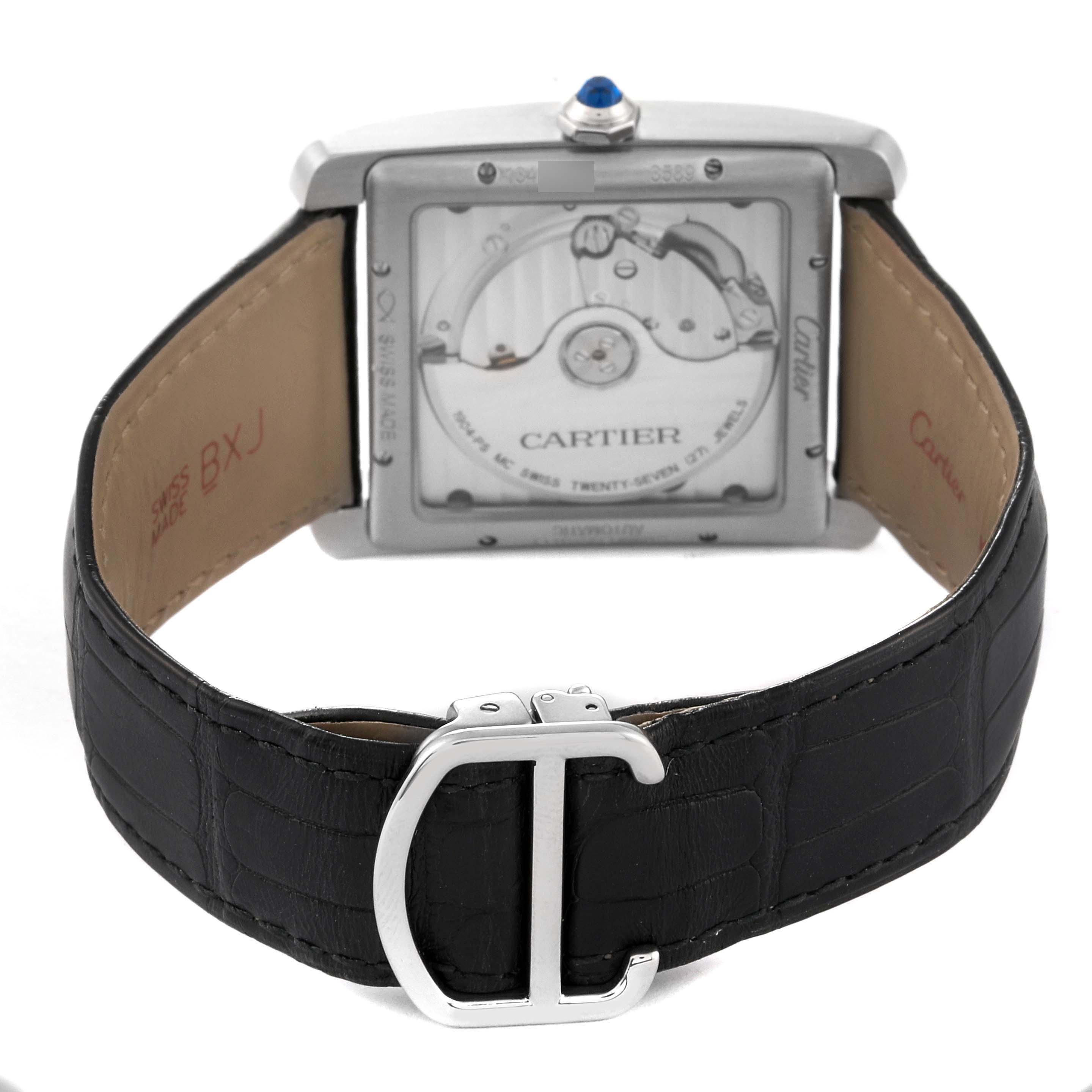 The Cartier Tank MC W5330004 Men
s Stainless Steel Black Dial W5330004 Men
s Stainless Steel Black Dial watch is shown from the back, displaying its transparent case back and black leather strap with a silver buckle.