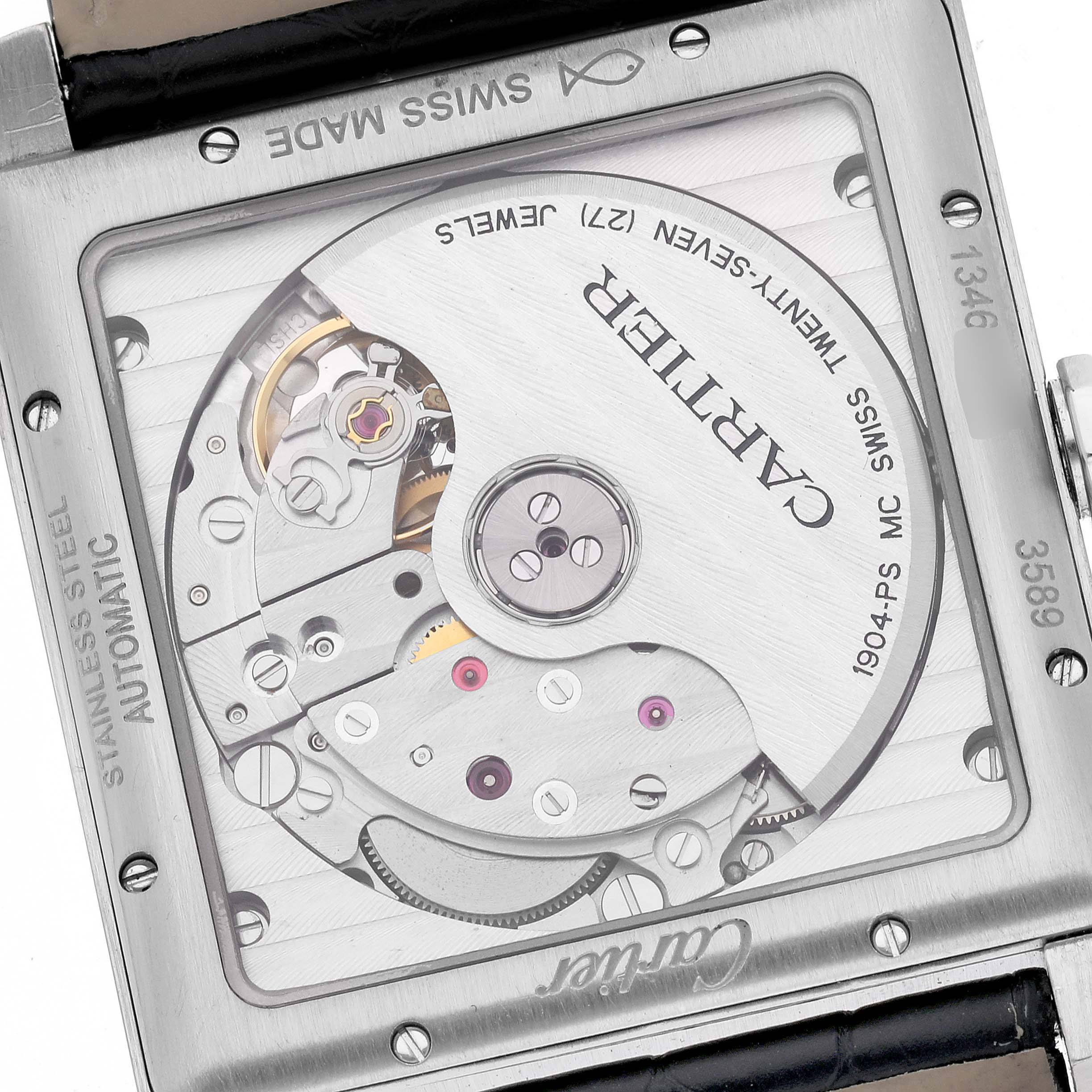 The image shows the back of a Cartier Tank MC W5330004 Men
s Stainless Steel Black Dial W5330004 Men
s Stainless Steel Black Dial watch, revealing the automatic movement and inner mechanical components.