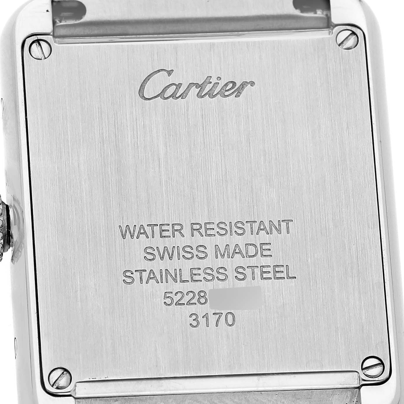 The image shows the back case of a Cartier Tank Solo W5200013 Women's Stainless Steel Silver Dial watch, displaying brand engraving and specifications.