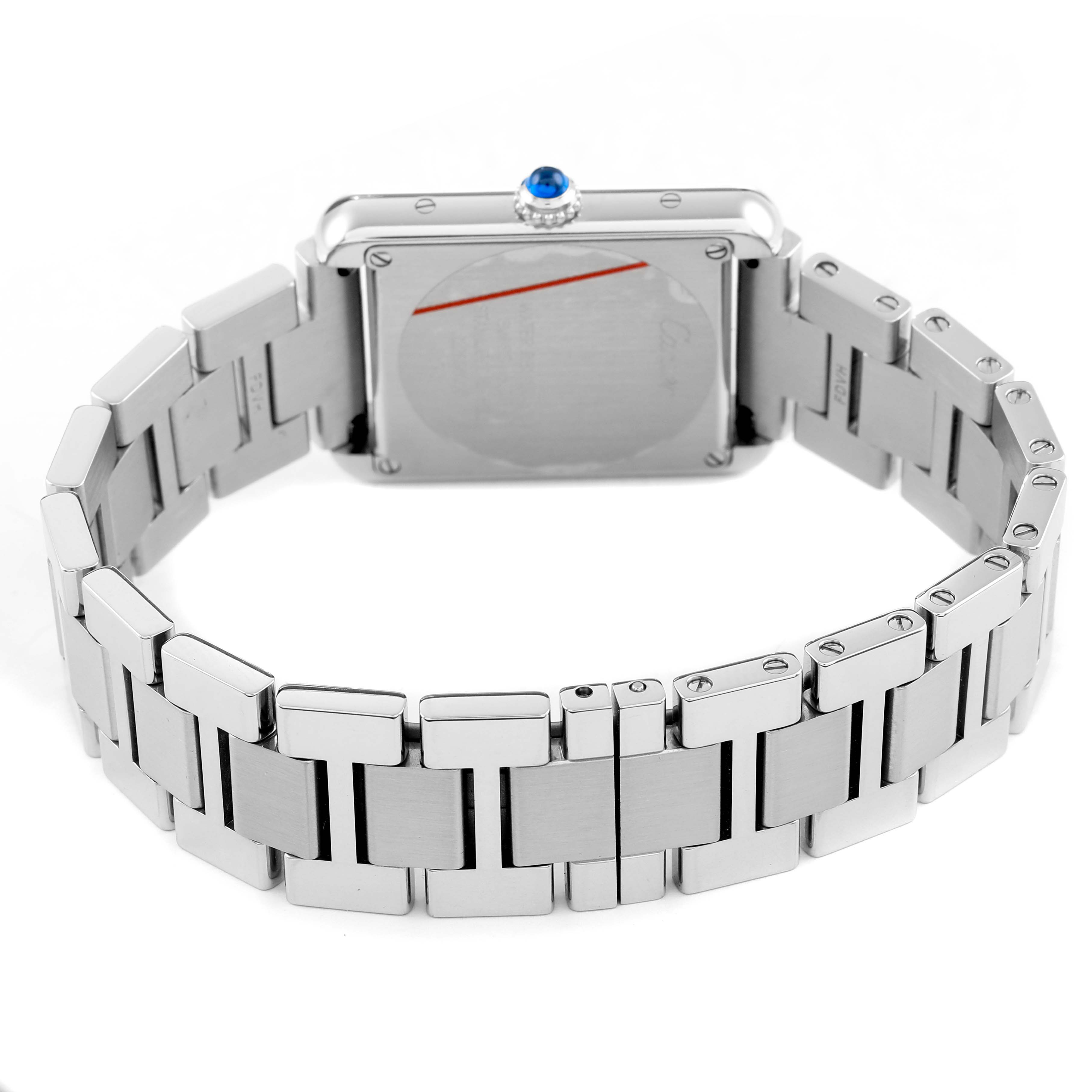 The image shows a Cartier Tank Solo W5200013 Women's Stainless Steel Silver Dial watch from the back, highlighting its metal bracelet and sapphire crown.