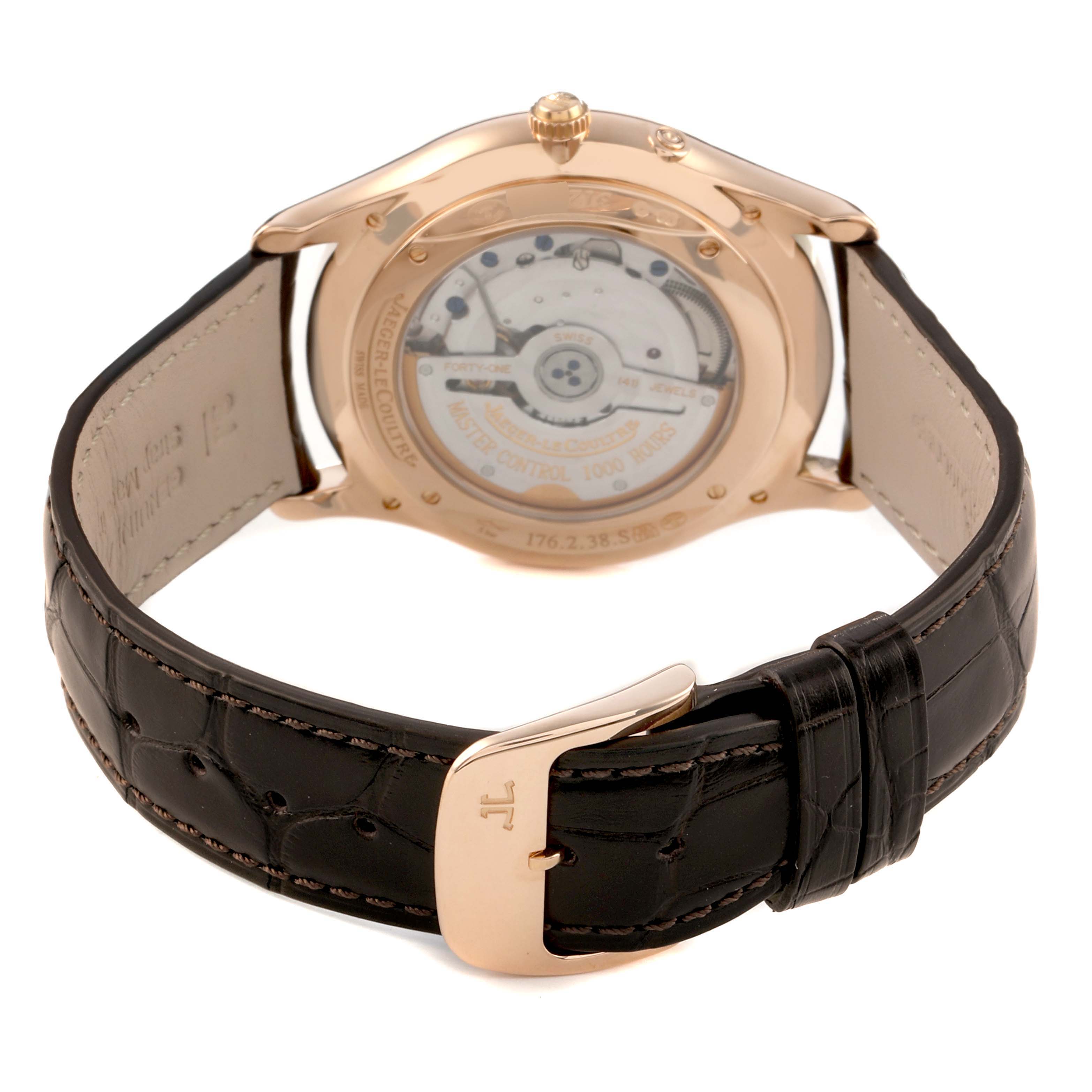 The image shows the back of a Jaeger LeCoultre Master 176.2.38.S / Q3123294 Men's Rose Gold Beige Dial watch, highlighting the movement and leather strap with a buckle.