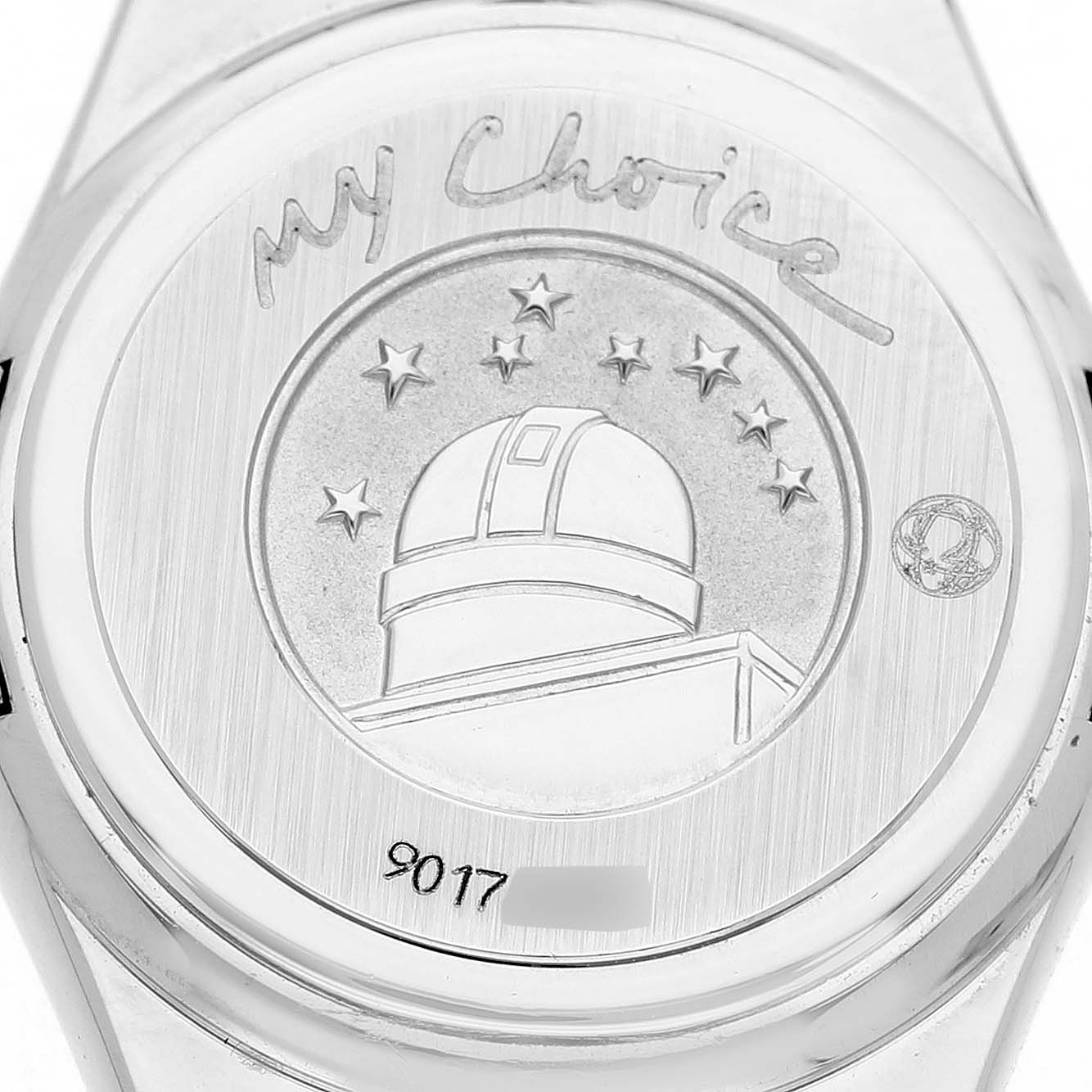 The image shows the case back of the Omega 1465.71.00 Women's Stainless Steel Mother of Pearl Dial Constellation My Choice MOP Diamond Steel Ladies Watch 1465.71.00, highlighting its engraved design.