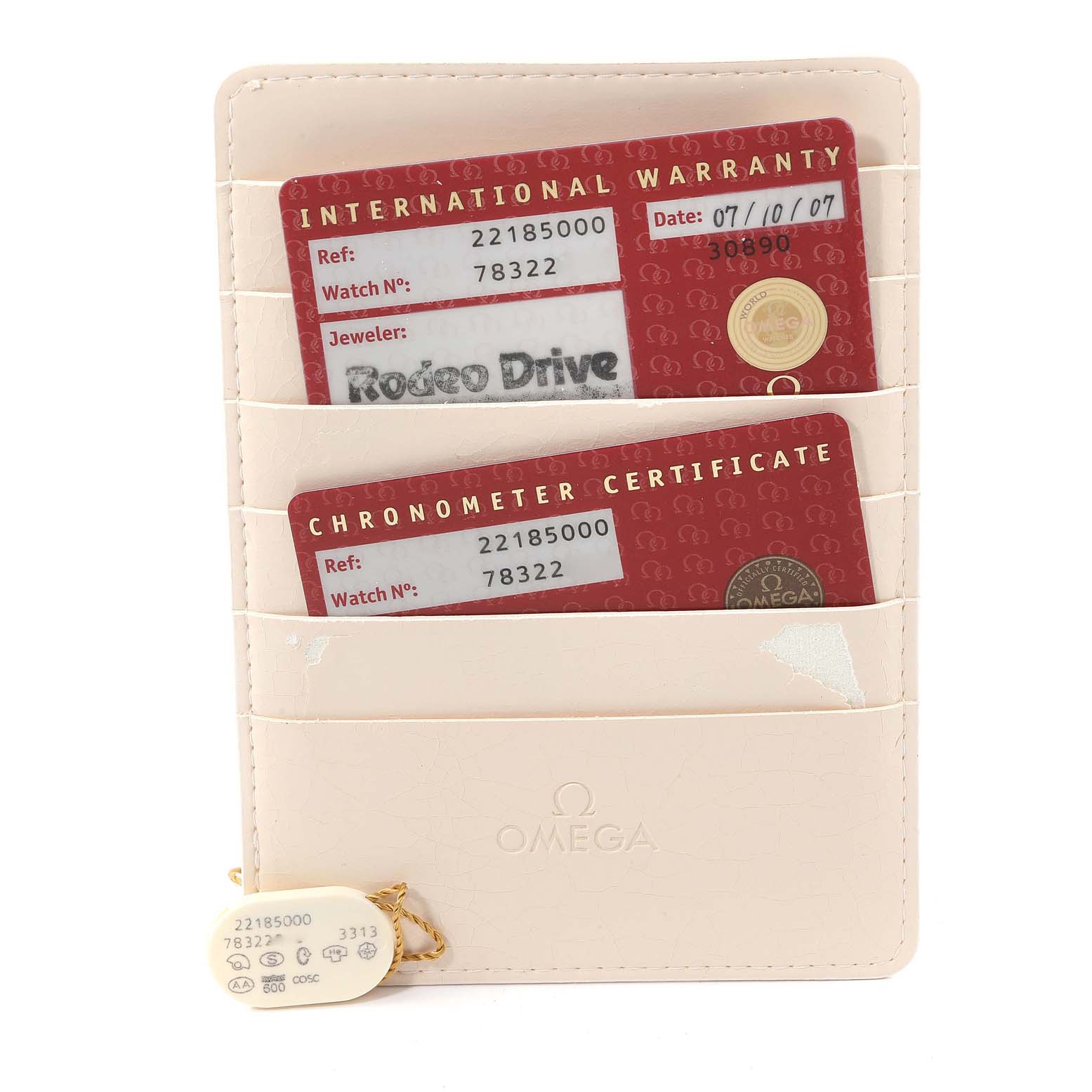 The image shows the warranty cards and certificate for the Omega Planet Ocean 2218.50.00 Men
s Stainless Steel Black Dial 2218.50.00 Men
s Stainless Steel Black Dial model watch.