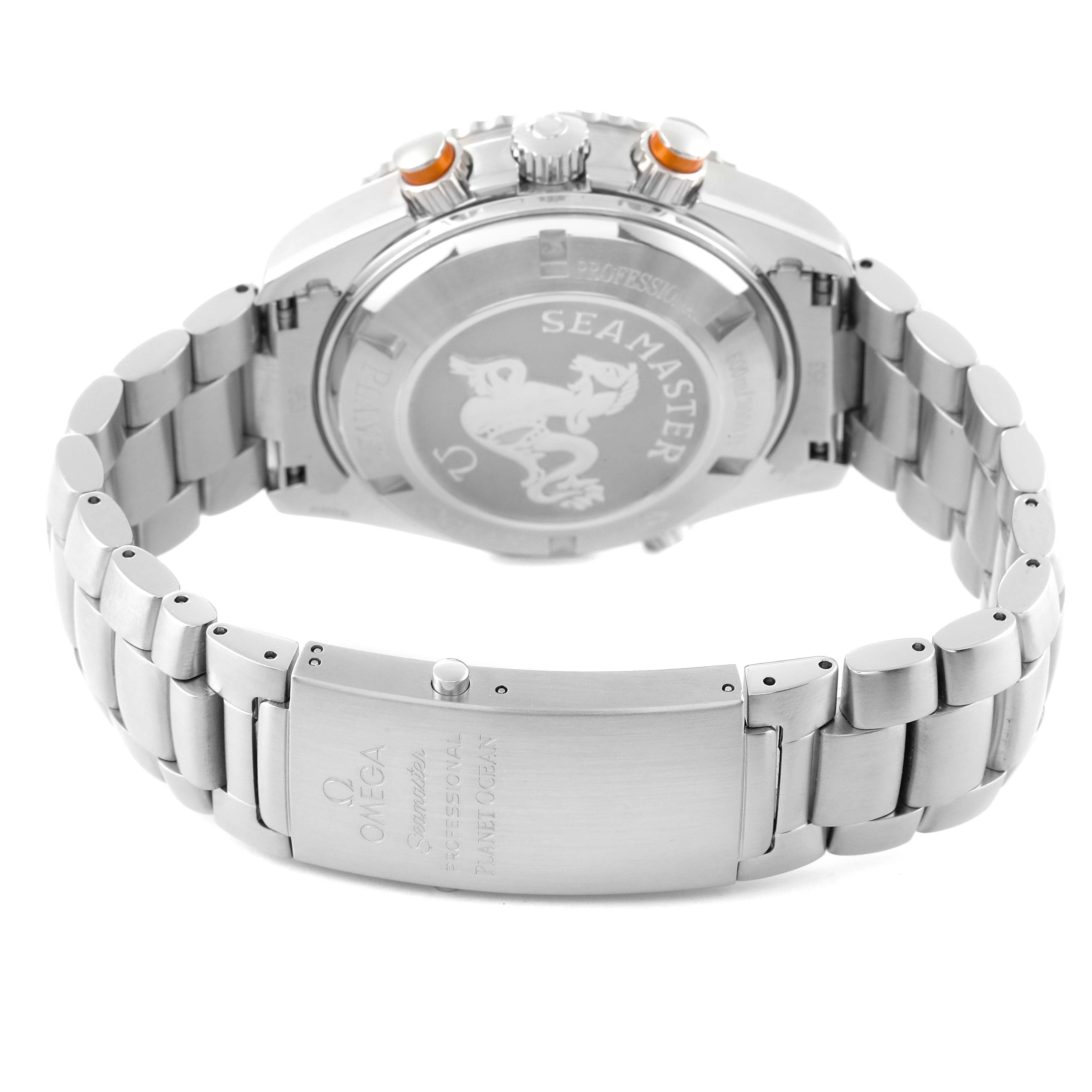 The image shows the back case and bracelet of an Omega Seamaster Planet Ocean watch, highlighting the clasp and pushers.