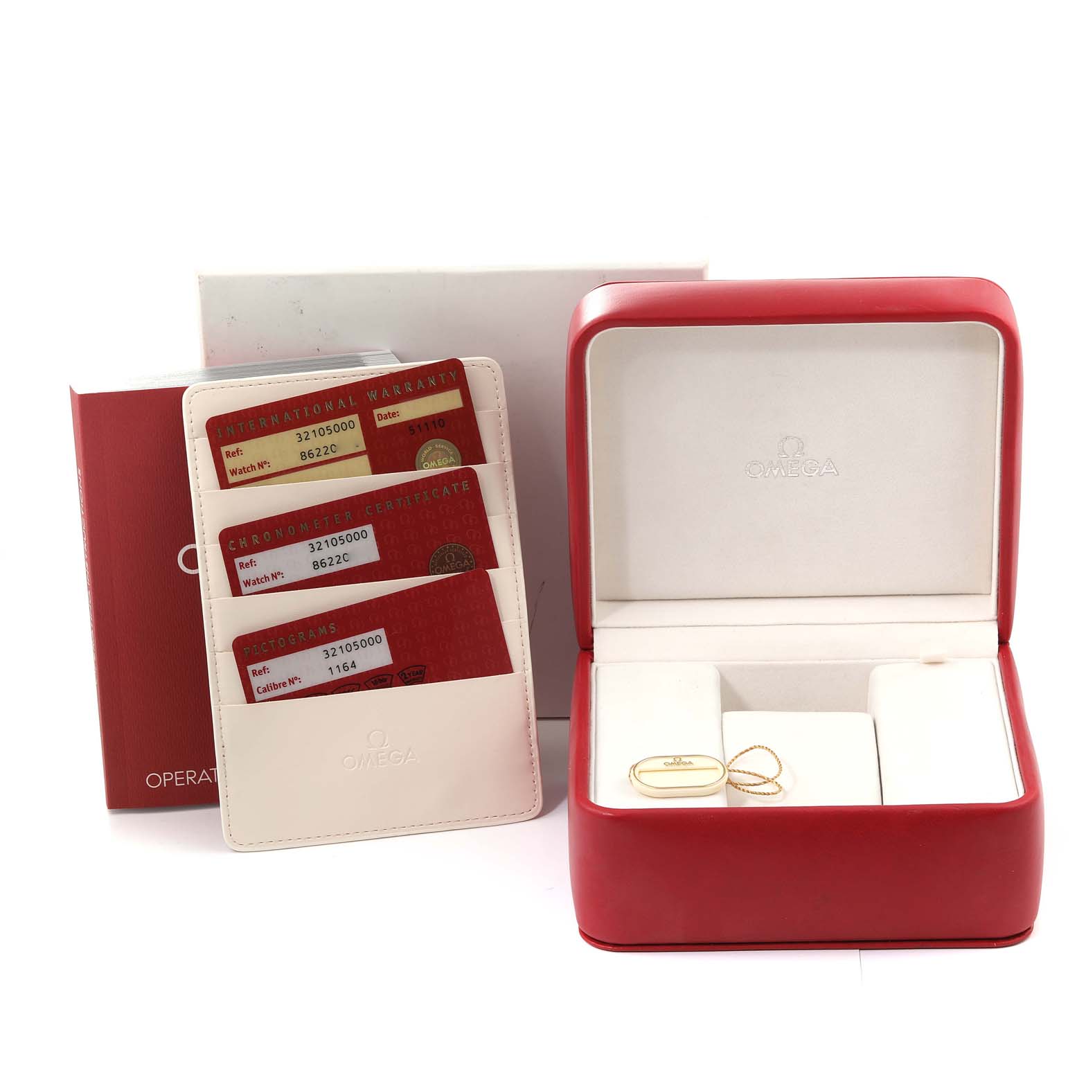 This image shows the packaging, warranty cards, certificate, and tag for an Omega Speedmaster 3210.50.00 Men
s Stainless Steel Black Dial 3210.50.00 Men
s Stainless Steel Black Dial watch, with an open box.