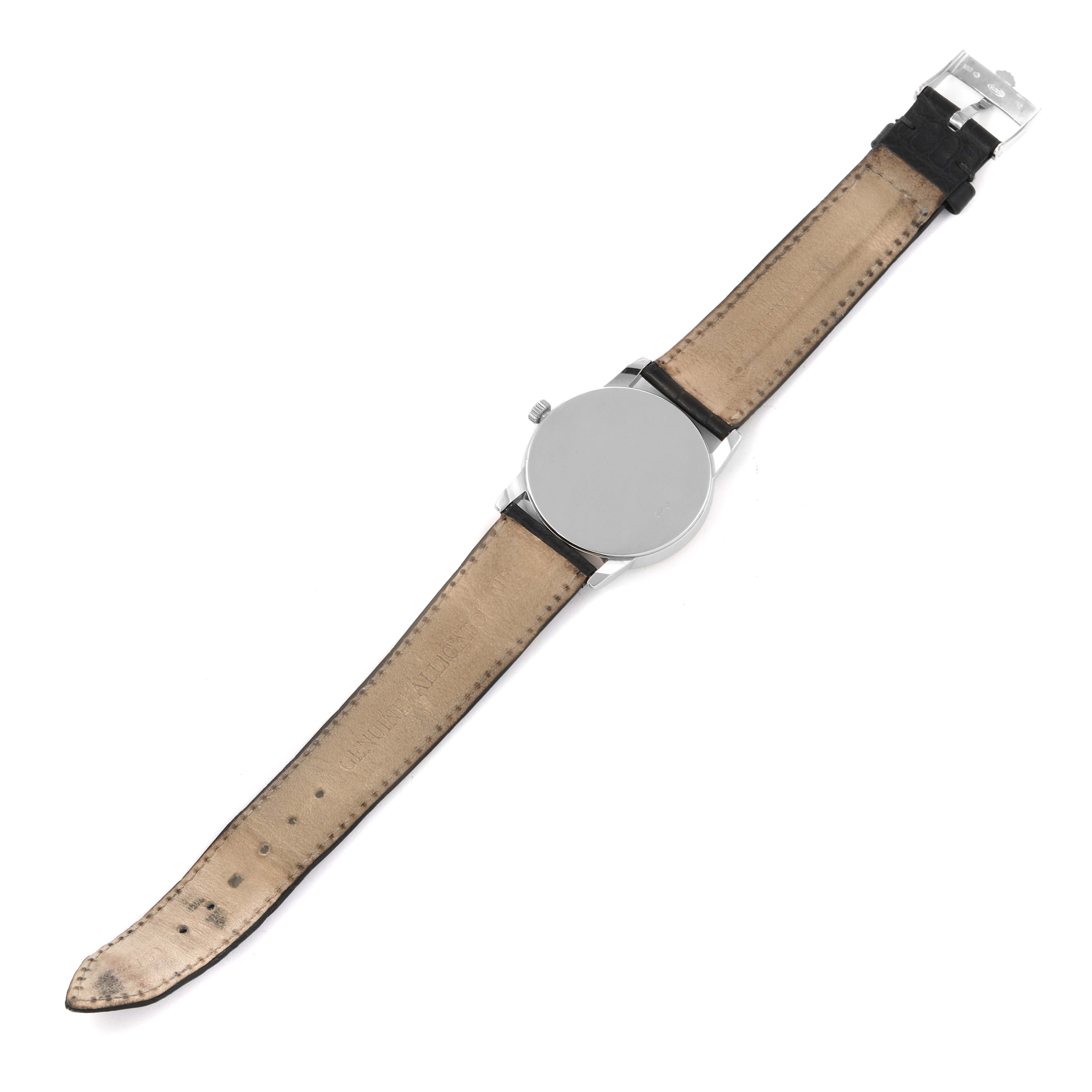 This image shows the back of the Rolex Cellini 5116/9 Men's White Gold Grey Dial 5116/9 Men's White Gold Grey Dial watch laid flat, focusing on the leather strap and metal case back.