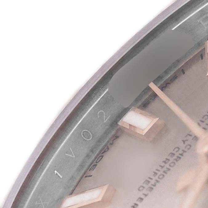 The image shows a close-up of the Rolex Datejust 279171 Women's Steel and Gold (two tone) Pink Dial's dial, highlighting the edge with markers and text details.