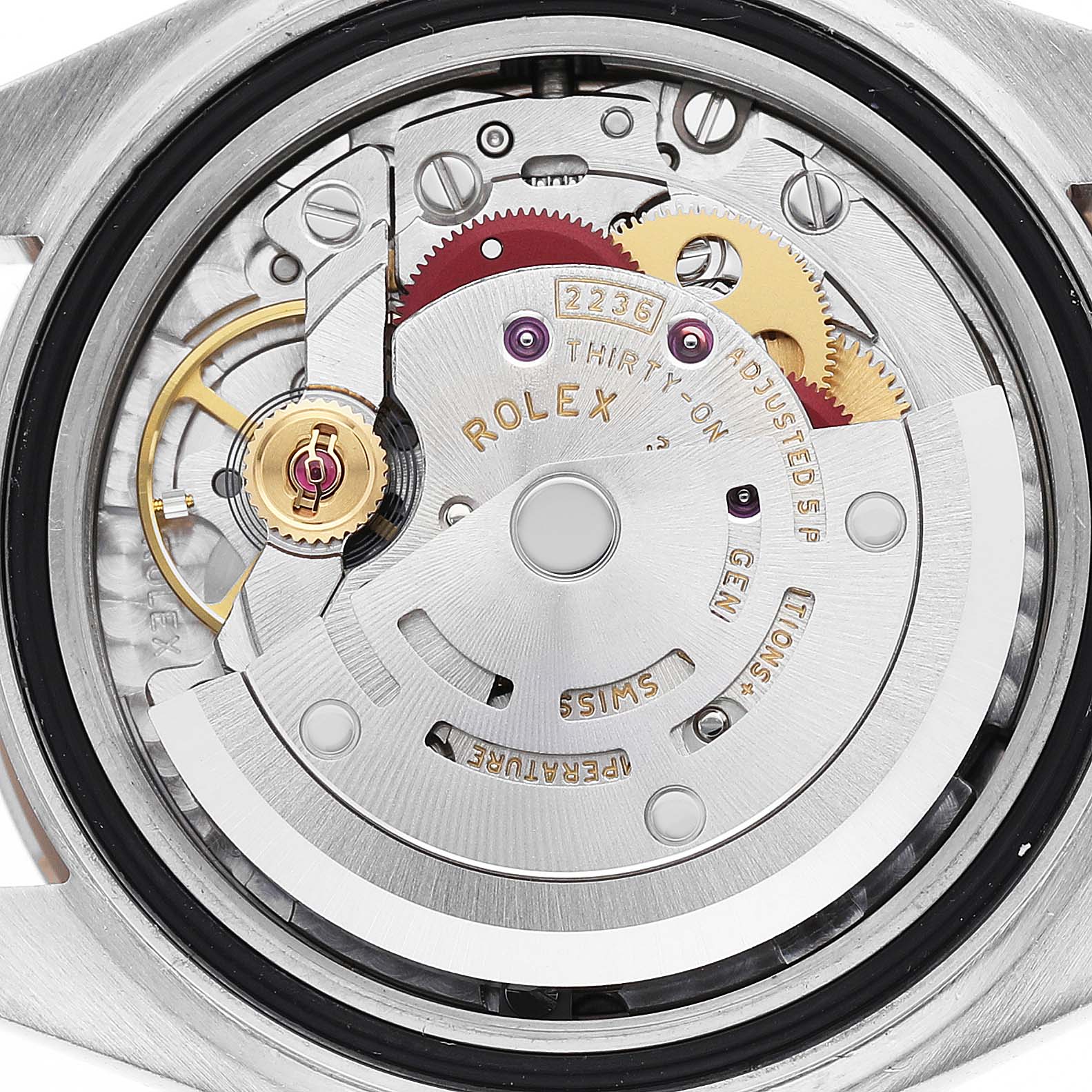 The image shows the Rolex Datejust 279171 Women's Steel and Gold (two tone) Pink Dial's movement from a top-down angle, highlighting the intricate gears and rotor.