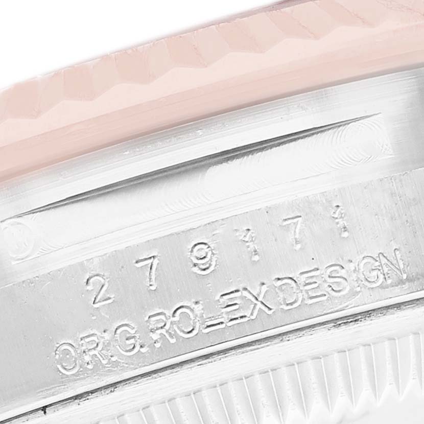 The image shows a close-up of the Rolex Datejust 279171 Women's Steel and Gold (two tone) Pink Dial's case side, featuring serial numbers and "ORIG. ROLEX DESIGN" engraving.