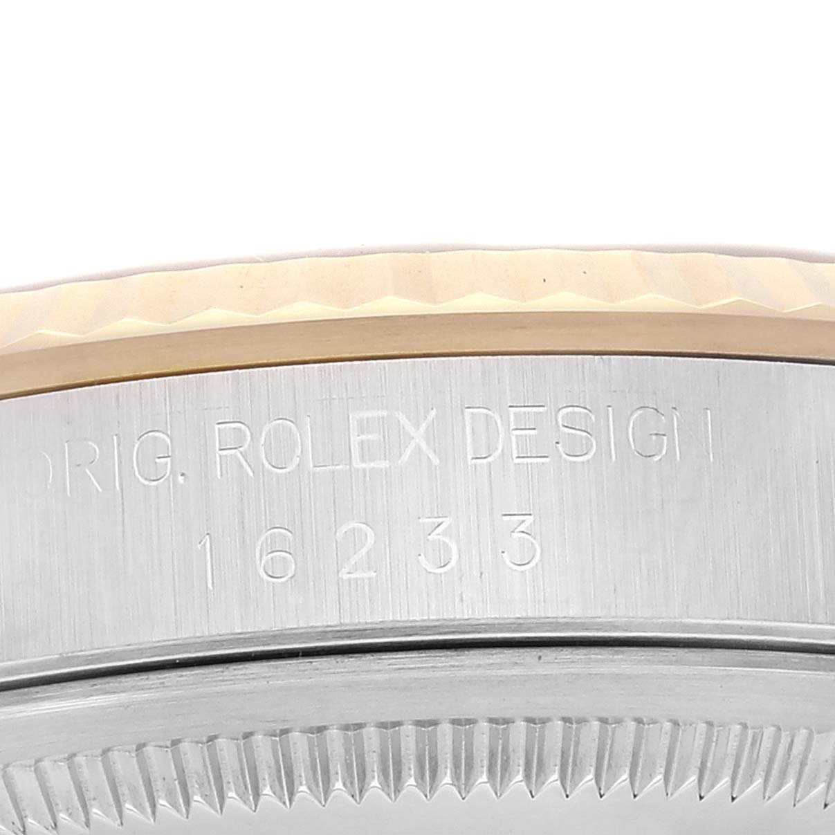 This close-up image shows the side of the case and the bezel of a Rolex Datejust 16233 Men's Steel and Gold (two tone) Blue Dial 16233 Men's Steel and Gold (two tone) Blue Dial model.