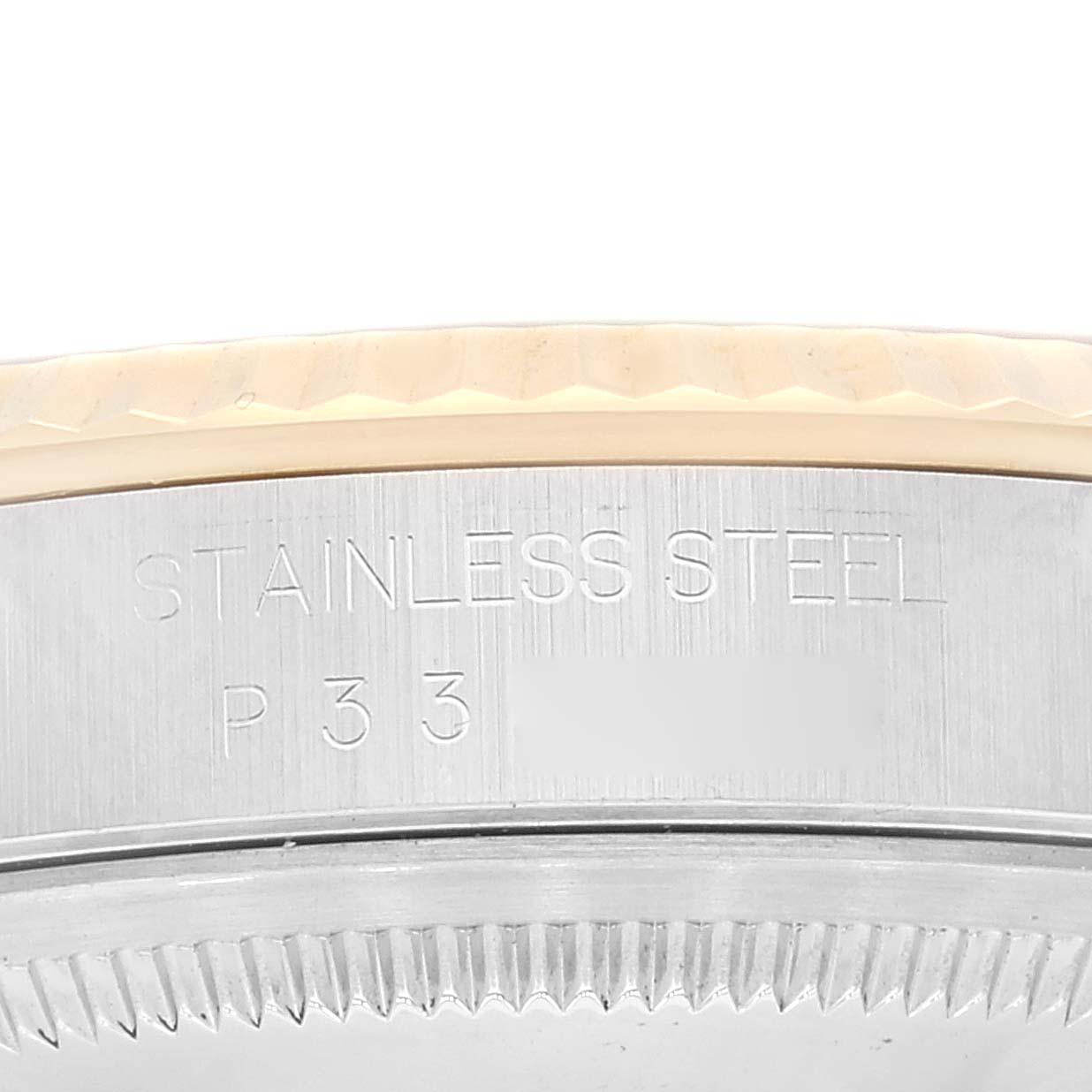This close-up image shows the side engraving and bezel of a Rolex Datejust 16233 Men's Steel and Gold (two tone) Blue Dial 16233 Men's Steel and Gold (two tone) Blue Dial watch in stainless steel.