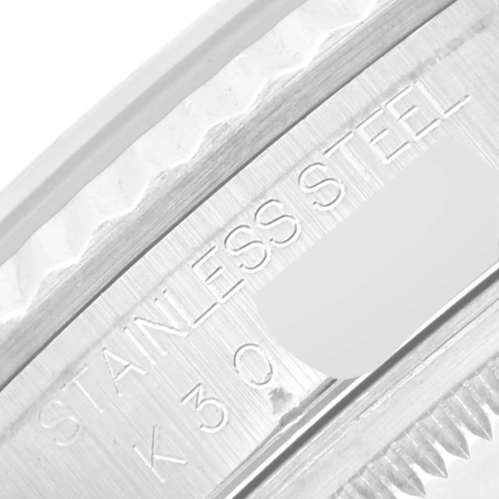 The image shows a close-up of the side engraving on the case of a stainless steel Rolex Datejust 16234 Men's Stainless Steel Blue Dial 16234 Men's Stainless Steel Blue Dial.