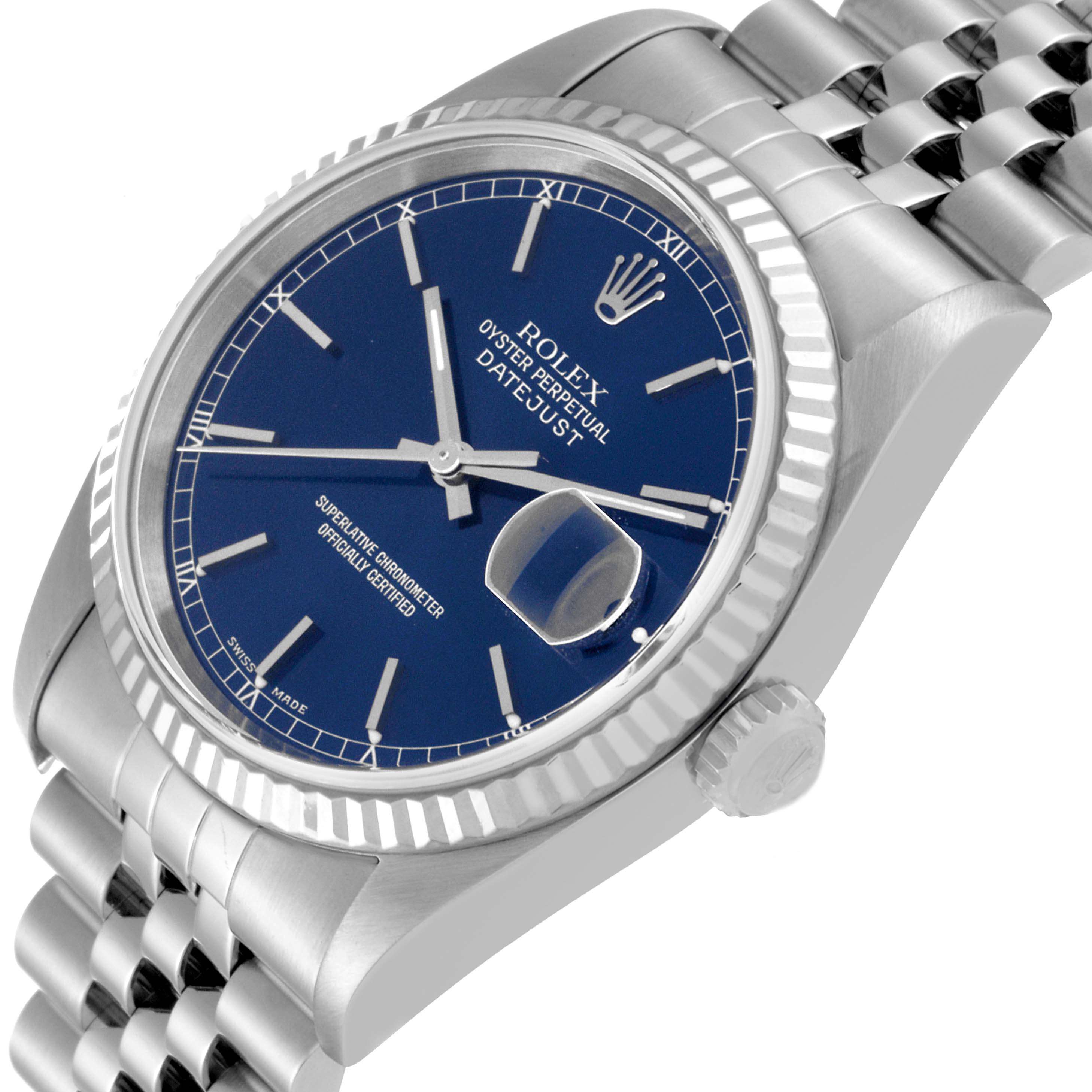 The image shows a side view of a Rolex Datejust 16234 Men's Stainless Steel Blue Dial 16234 Men's Stainless Steel Blue Dial watch, highlighting its blue dial, fluted bezel, cyclops lens, and jubilee bracelet.
