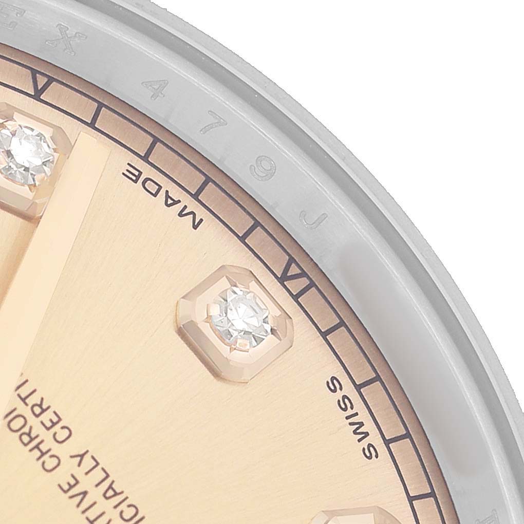 The image shows a close-up of the Rolex Datejust 41 116333 Men's Steel and Gold (two tone) Champagne Dial dial, featuring diamond markers and part of the bezel.