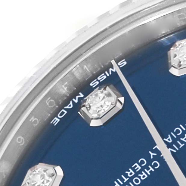 The image shows a close-up of a Rolex Mid-Size 178274 Women
s Stainless Steel Blue Dial 178274 Women
s Stainless Steel Blue Dial model watch, focusing on the blue dial, diamond indices, and hour hand.