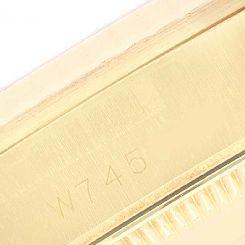 This close-up image shows the serial number engraving on the Rolex President 68278 Women
s Yellow Gold White Dial 68278 Women
s Yellow Gold White Dial model watch case.
