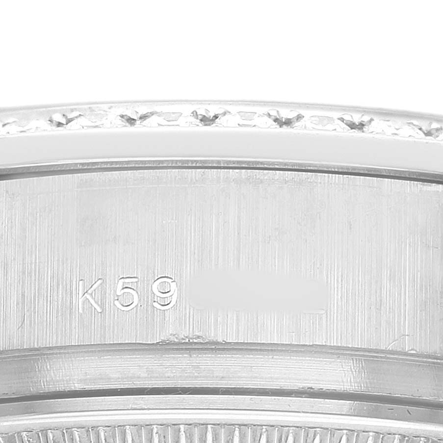 The image shows a close-up of the case with engravings on the Rolex President 179159 Women's White Gold Silver Dial watch.